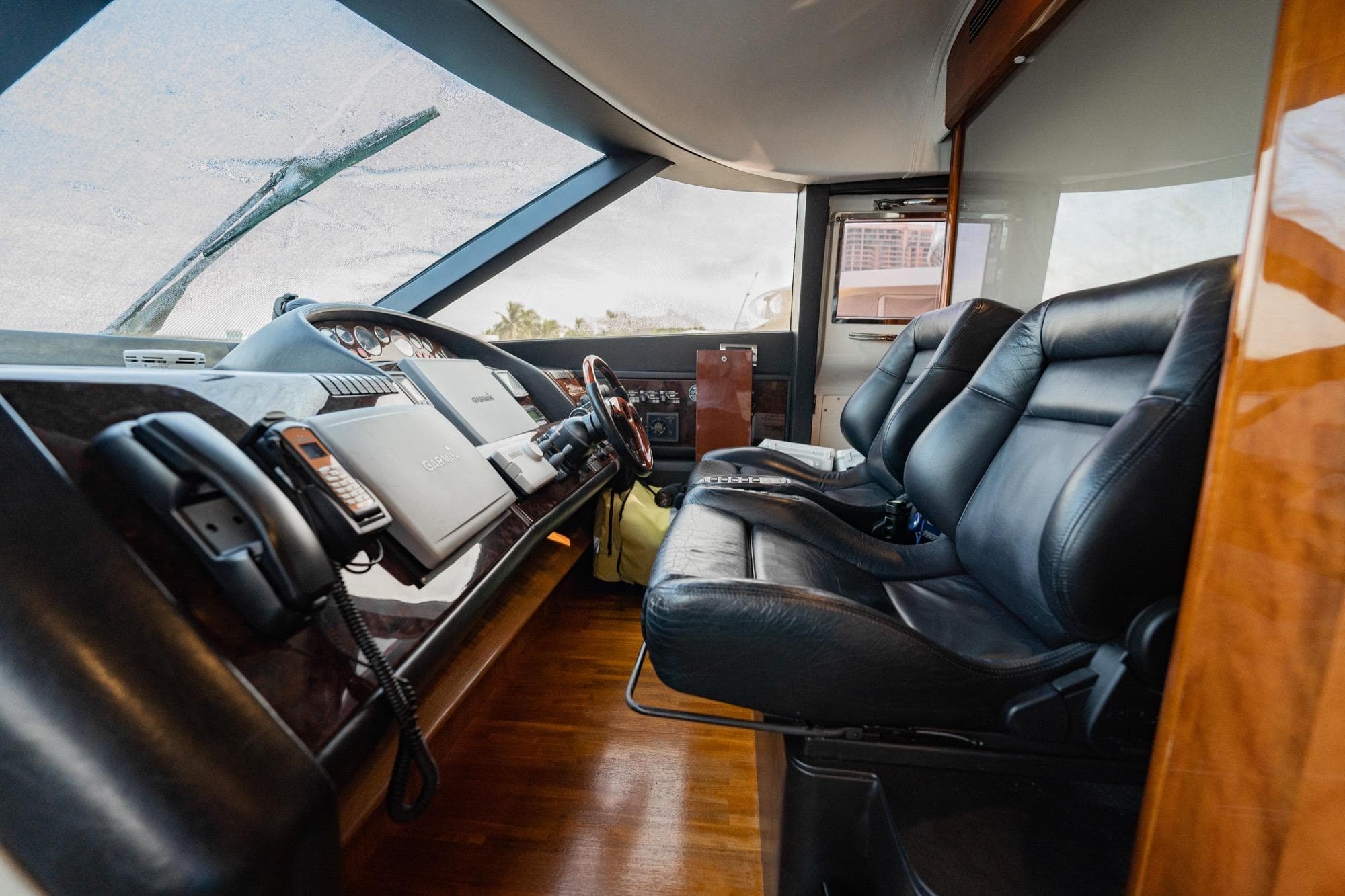 2004 Viking Princess Flybridge yacht interior with leather seats and control panel.