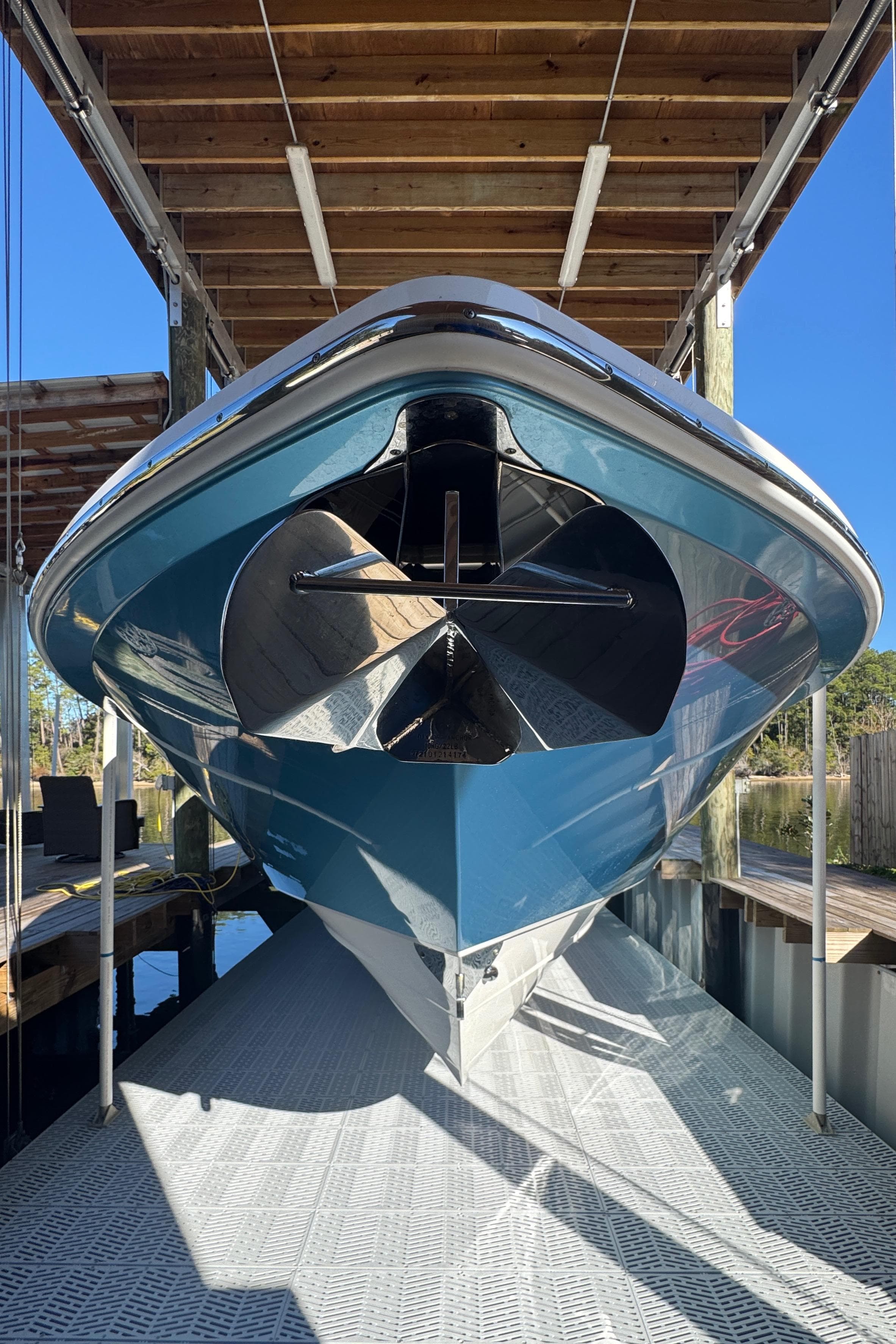 2016 Everglades 435 Center Console boat in dock, viewed from the front.