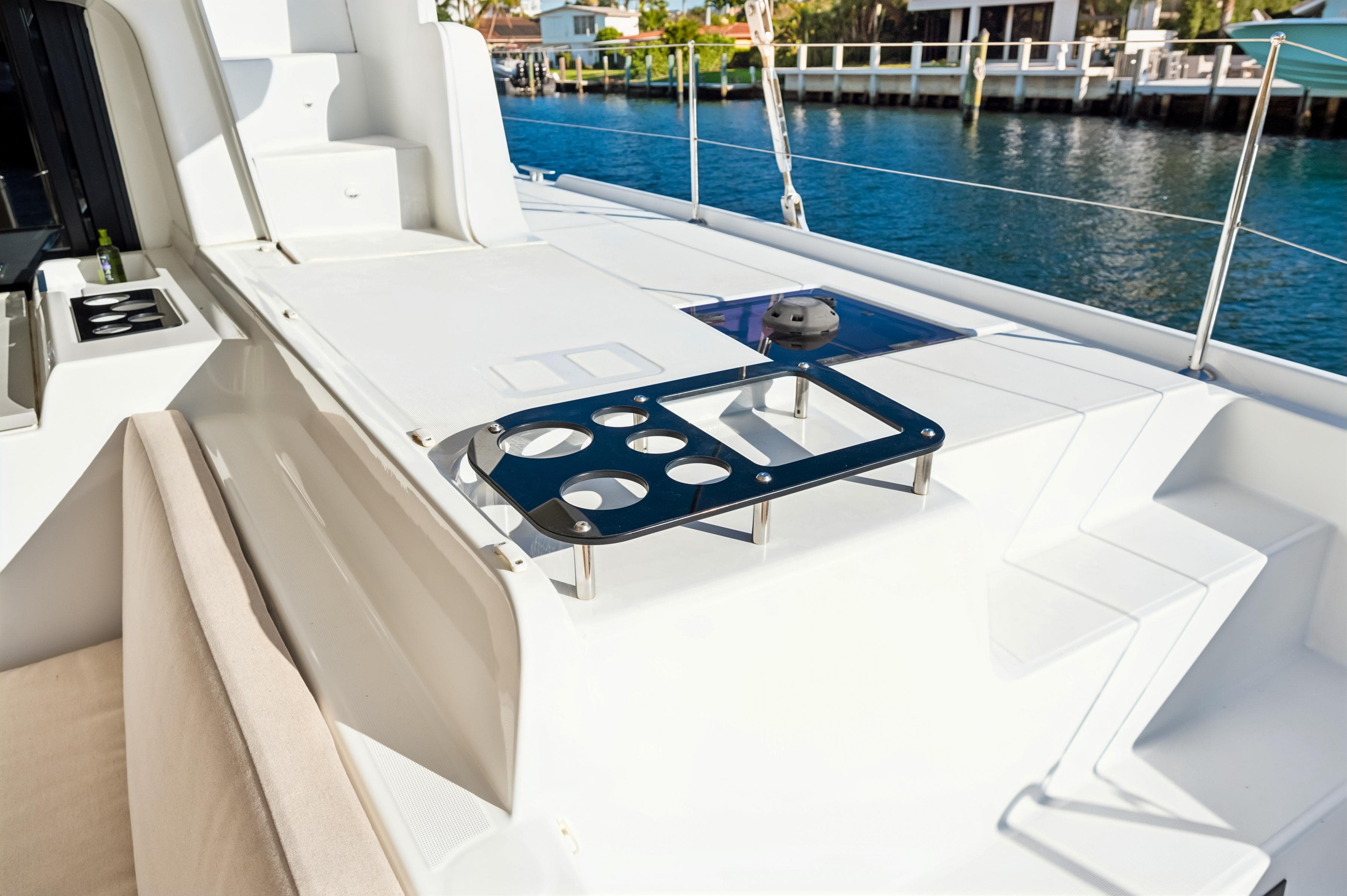 Luxurious 2022 Lagoon 46 yacht deck with seating and ocean view.