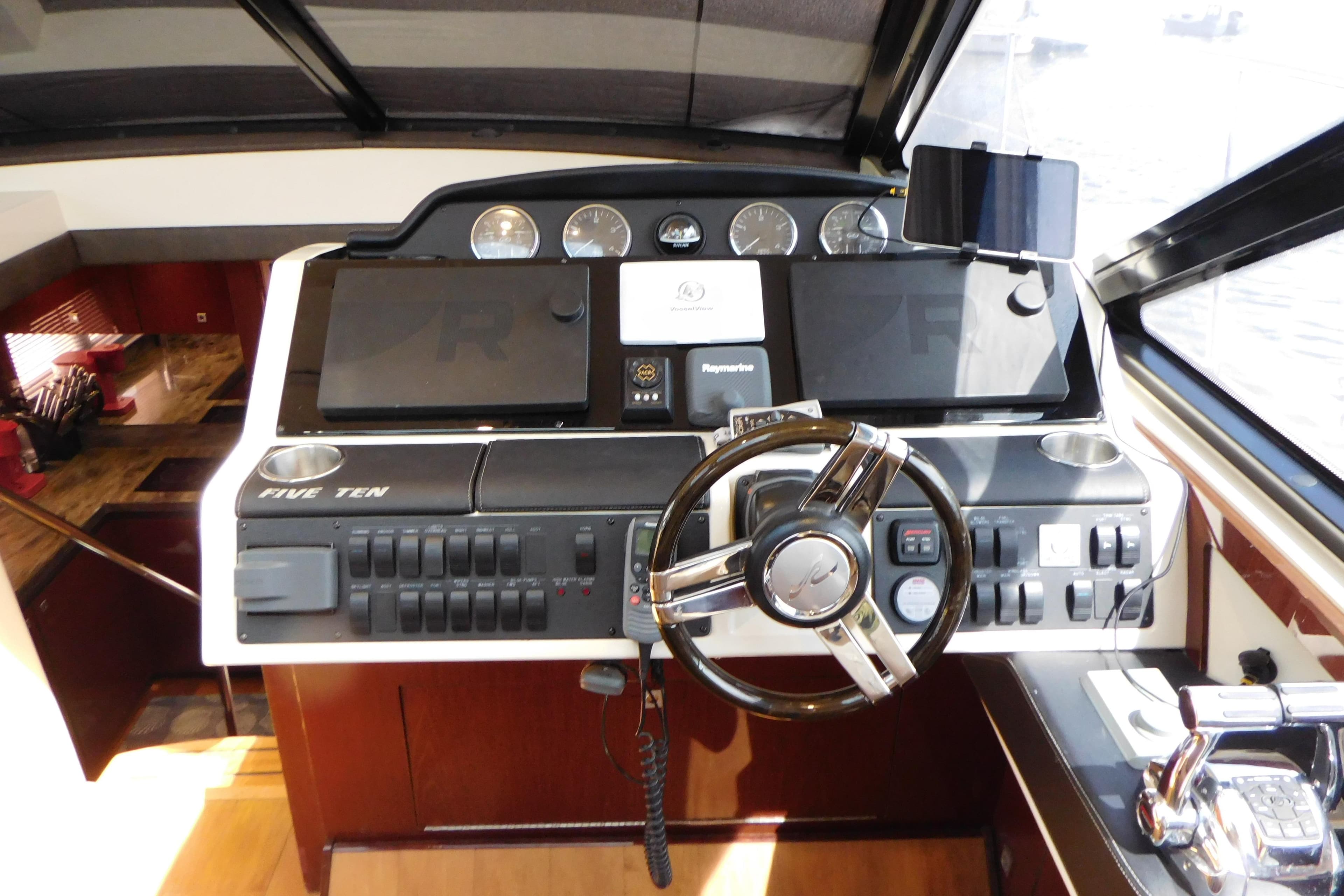 2013 Sea Ray 510 Sundancer helm with modern controls and navigation equipment.