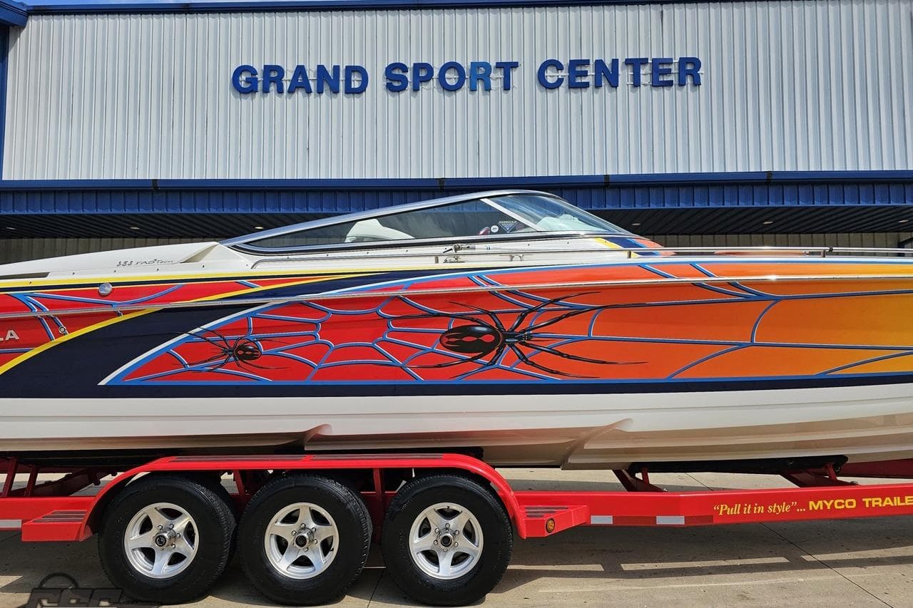 2007 Formula 353 FASTech boat with vibrant graphics at Grand Sport Center.