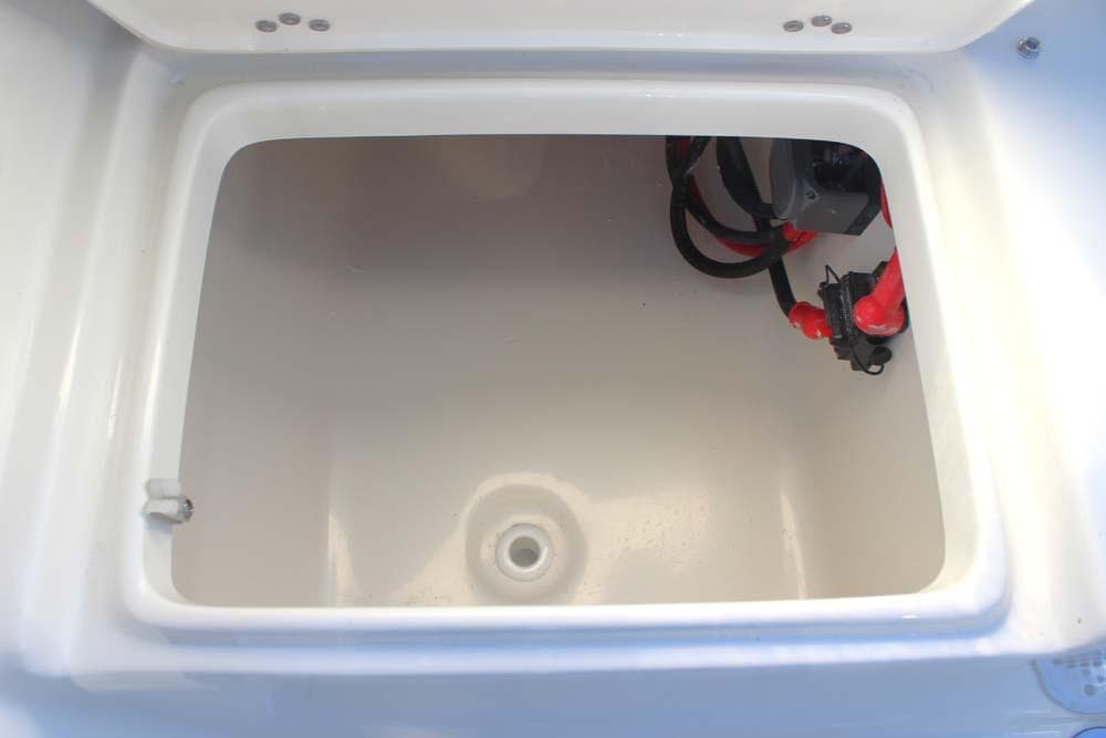 2025 Key West 203 FS boat storage compartment with wiring.