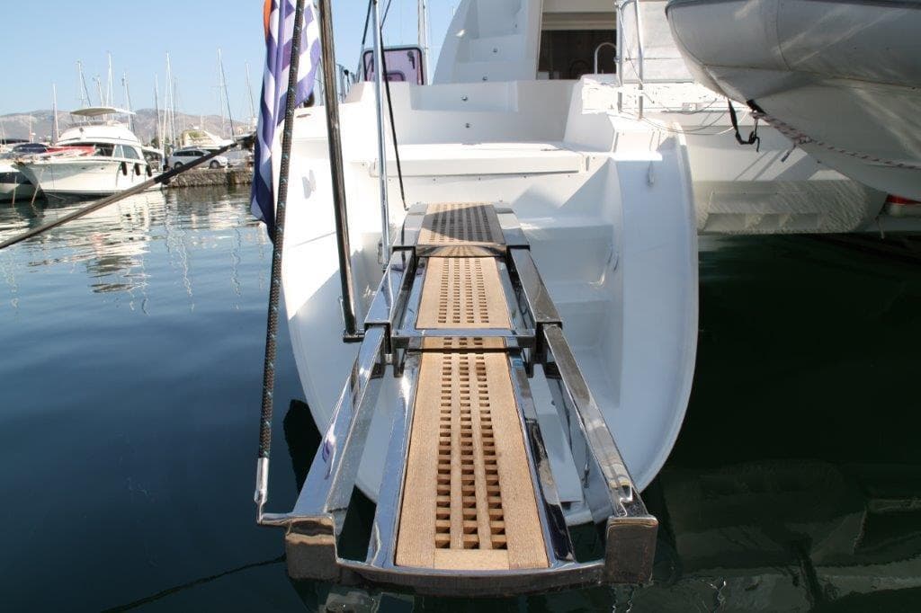 2009 Lagoon 500 catamaran with gangway in harbor.