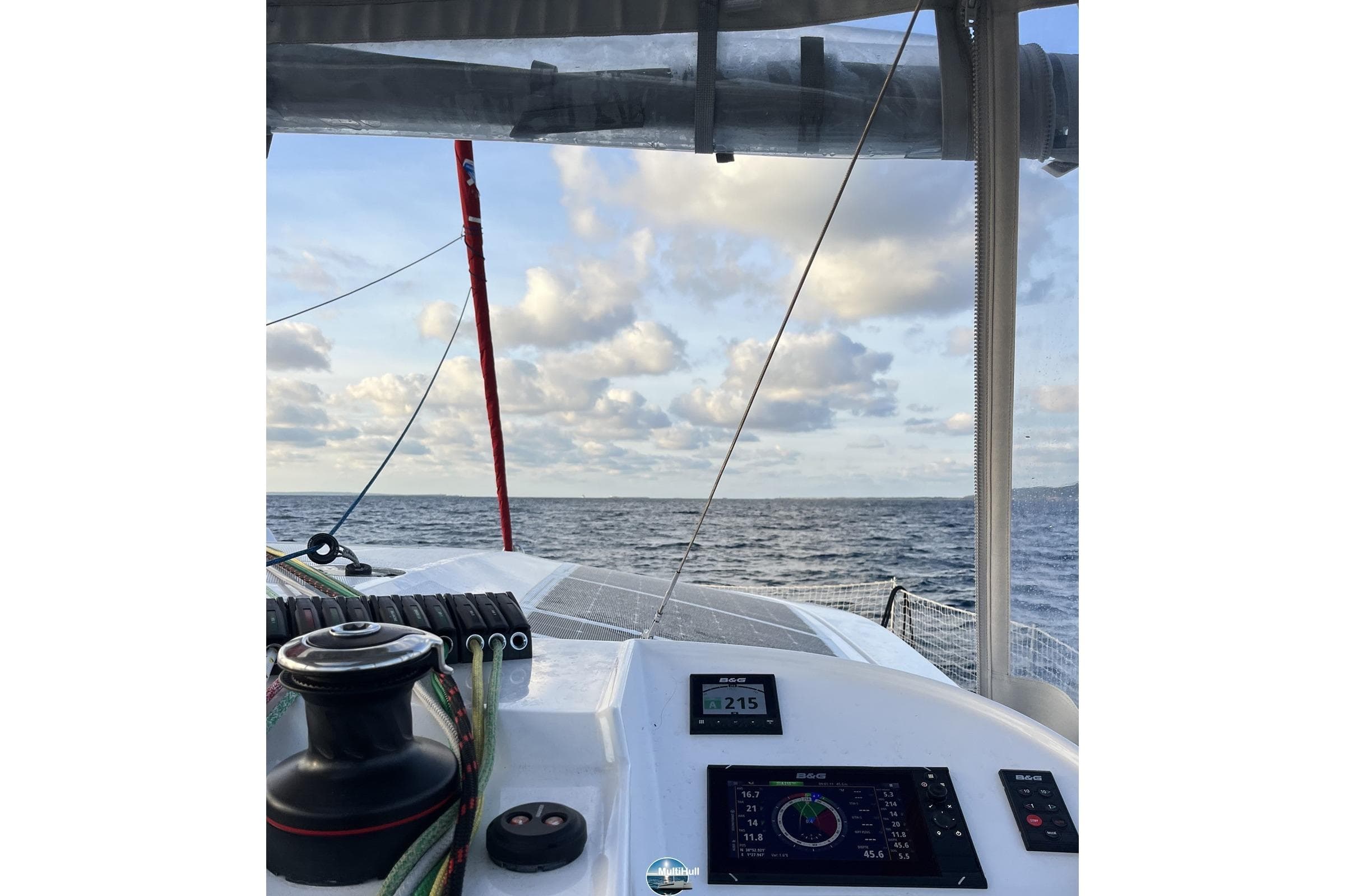 Cockpit view from a 2023 NEEL 43 trimaran sailing on open sea.