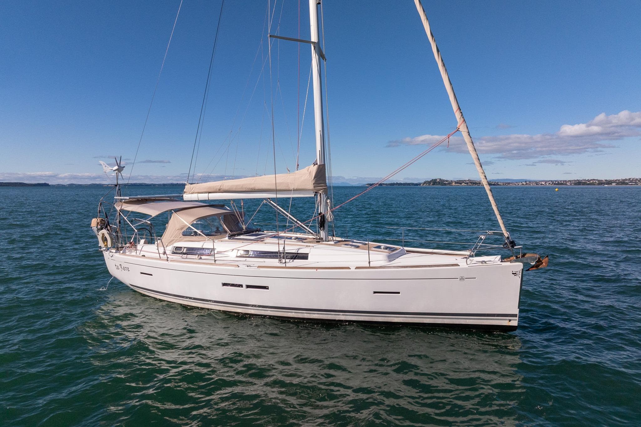 Sailing yacht Dufour 405 GL 2011 on calm sea under clear blue sky.