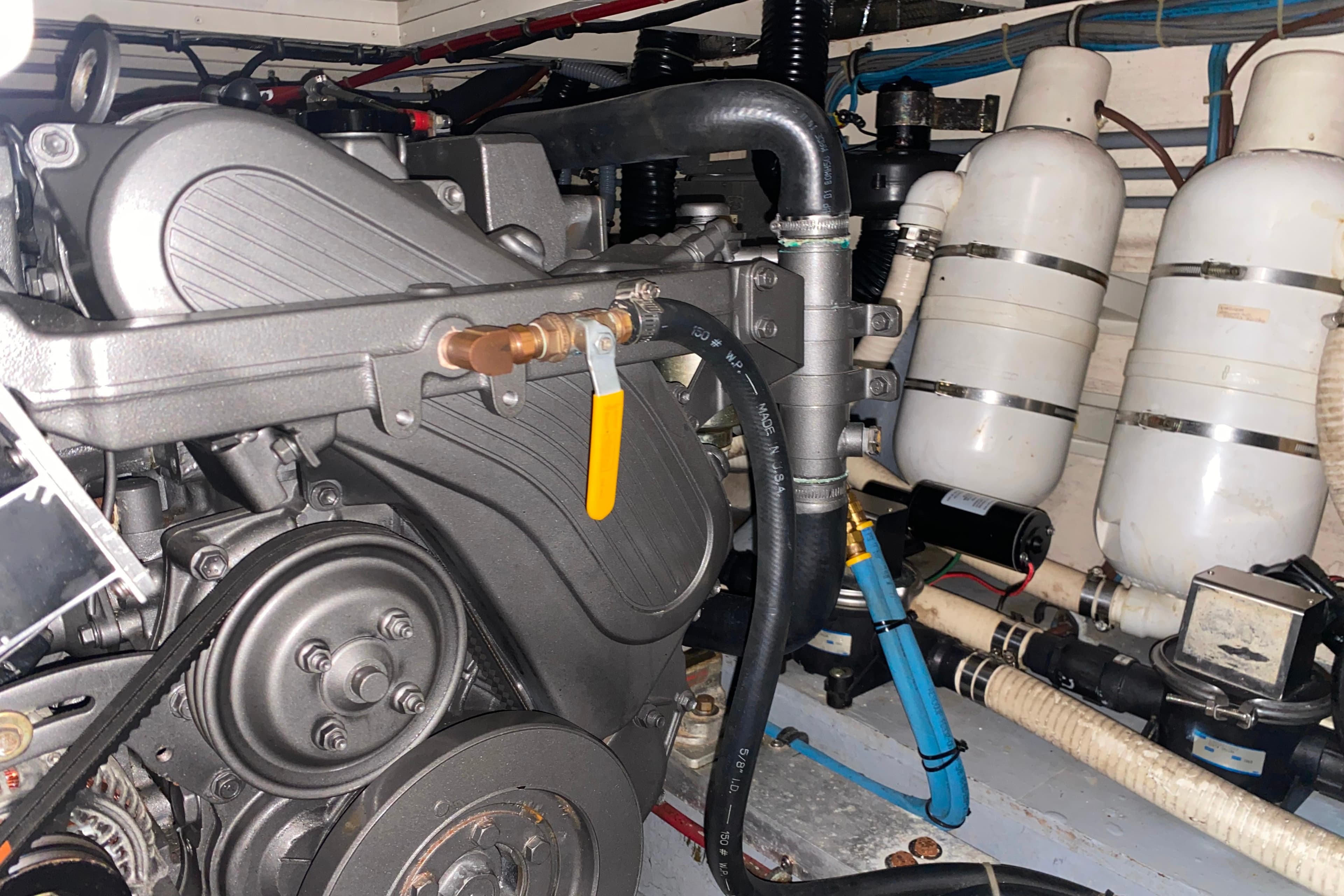 Engine room of 1988 Hatteras 40 Double Cabin with visible machinery and components.