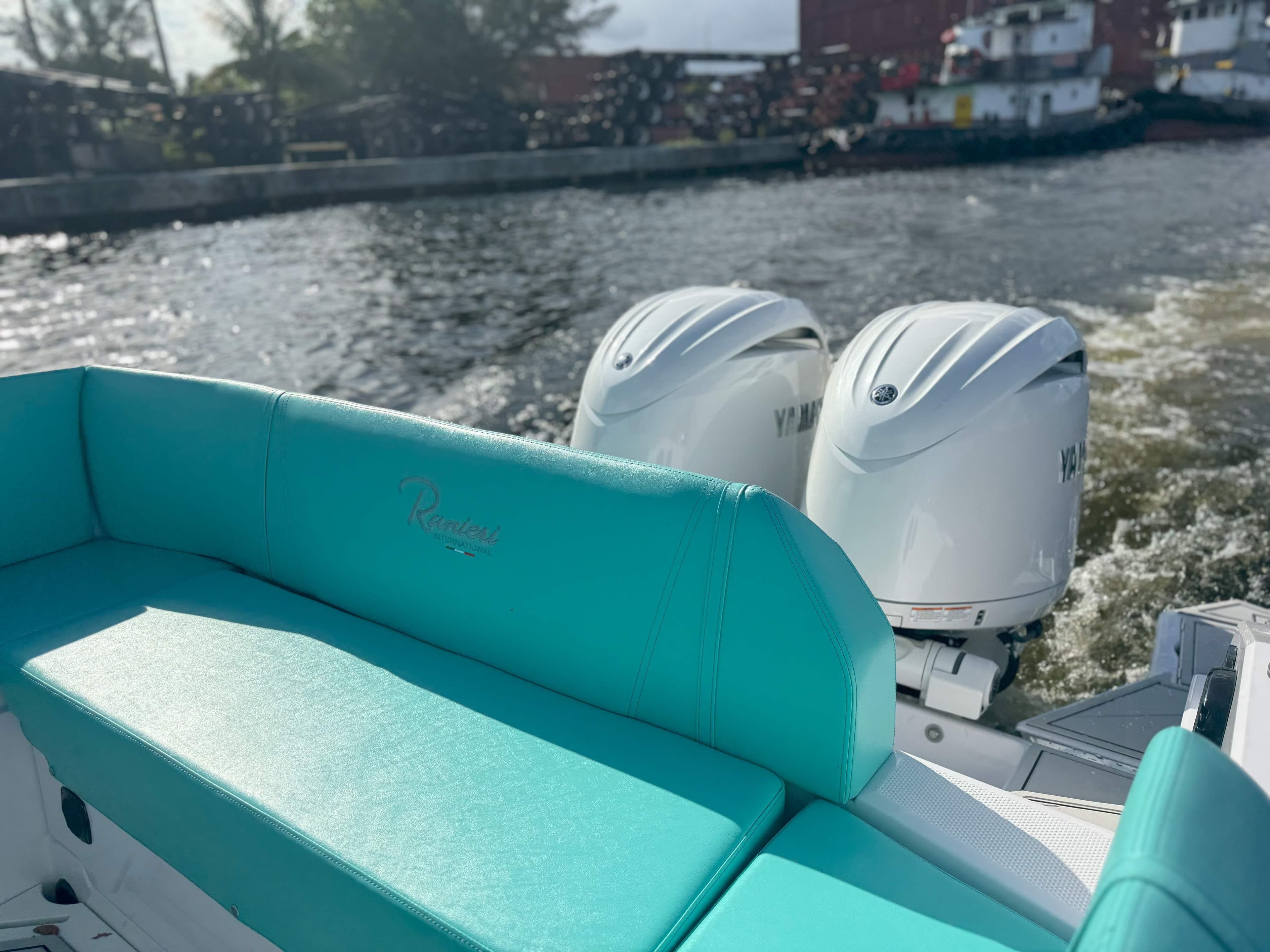 2025 Ranieri CAYMAN 27.0 SPORT TOURING boat with twin Yamaha engines on a river.