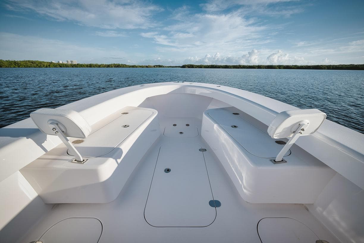 2024 Birdsall 30 boat interior with seating, on calm water.