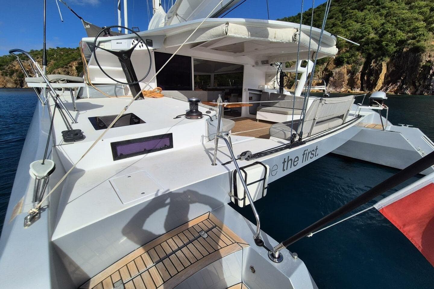 Luxury Alibi 54 catamaran from 2016 docked in scenic coastal waters.