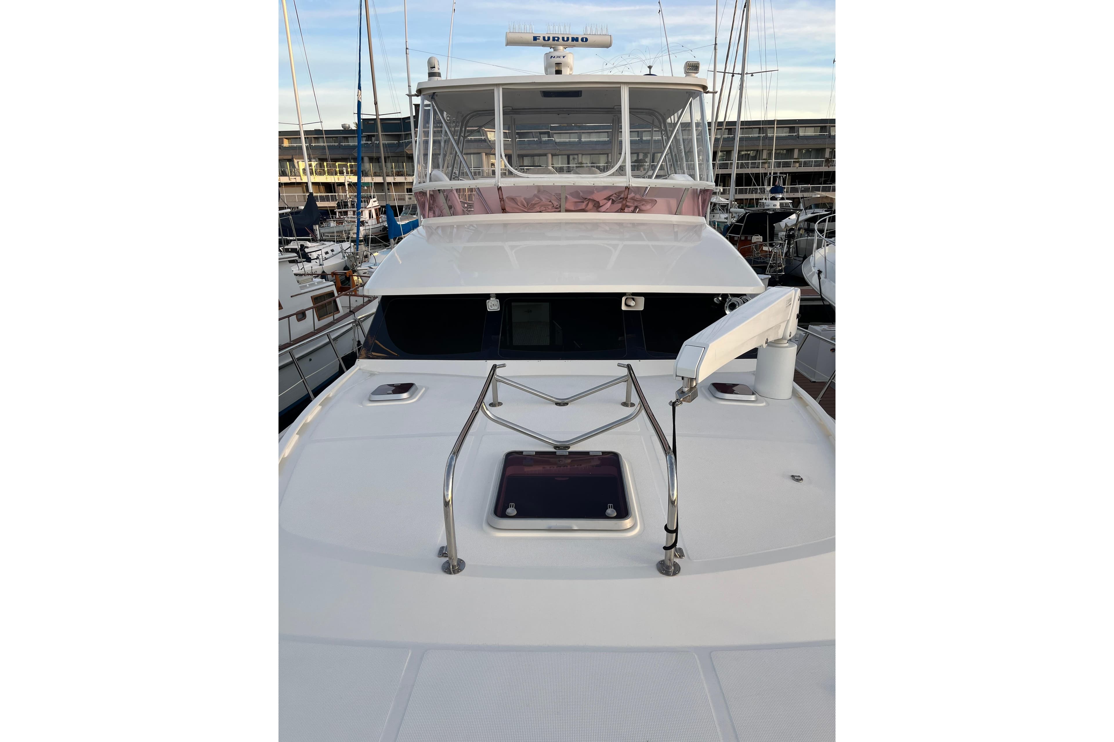 2007 Mikelson Sportfisher yacht docked at marina, showcasing sleek design and modern features.
