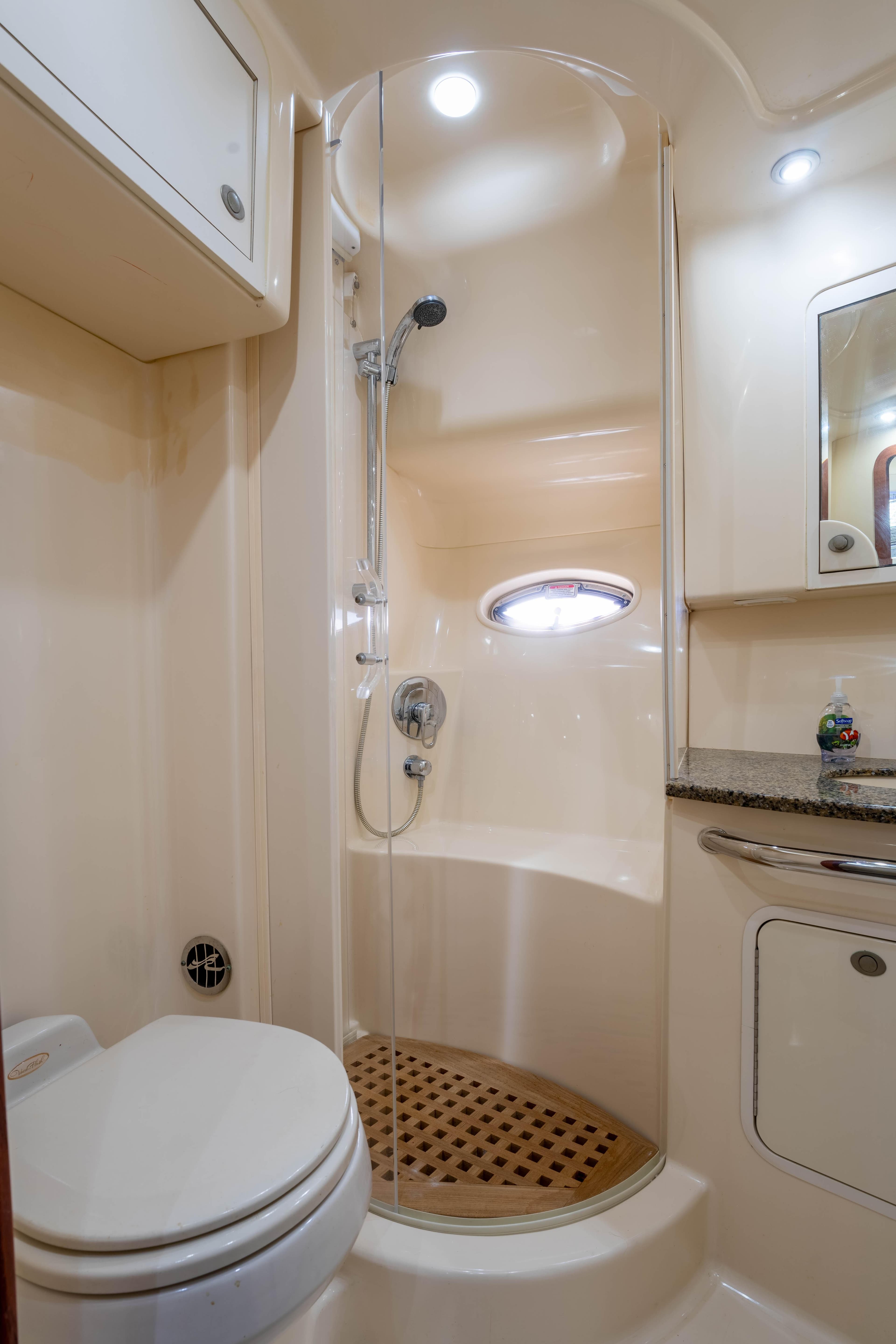 Luxurious bathroom in 2005 Sea Ray 480 Motor Yacht with shower and toilet.