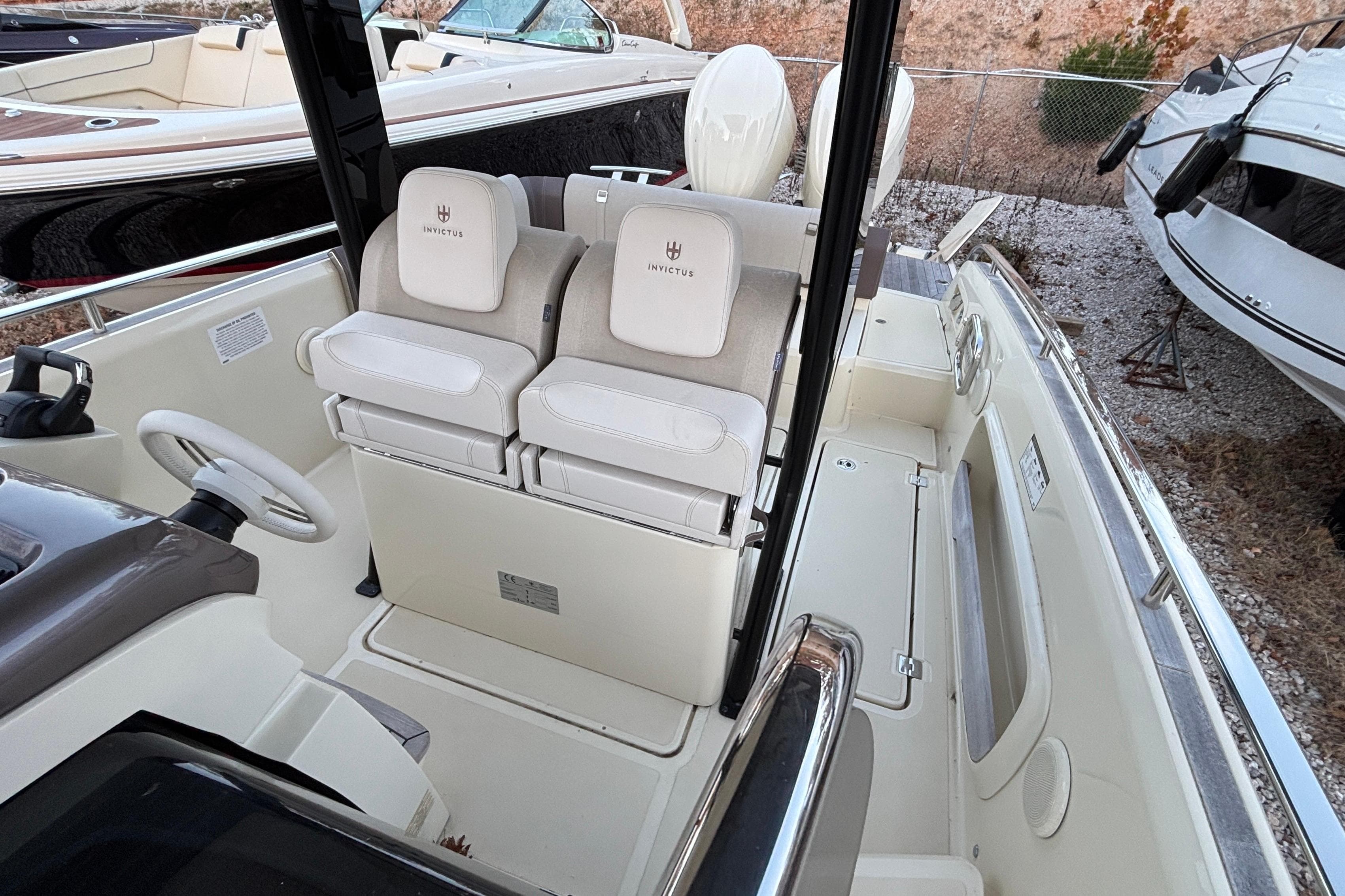 2024 Invictus GT280S boat interior with dual seats and steering wheel.