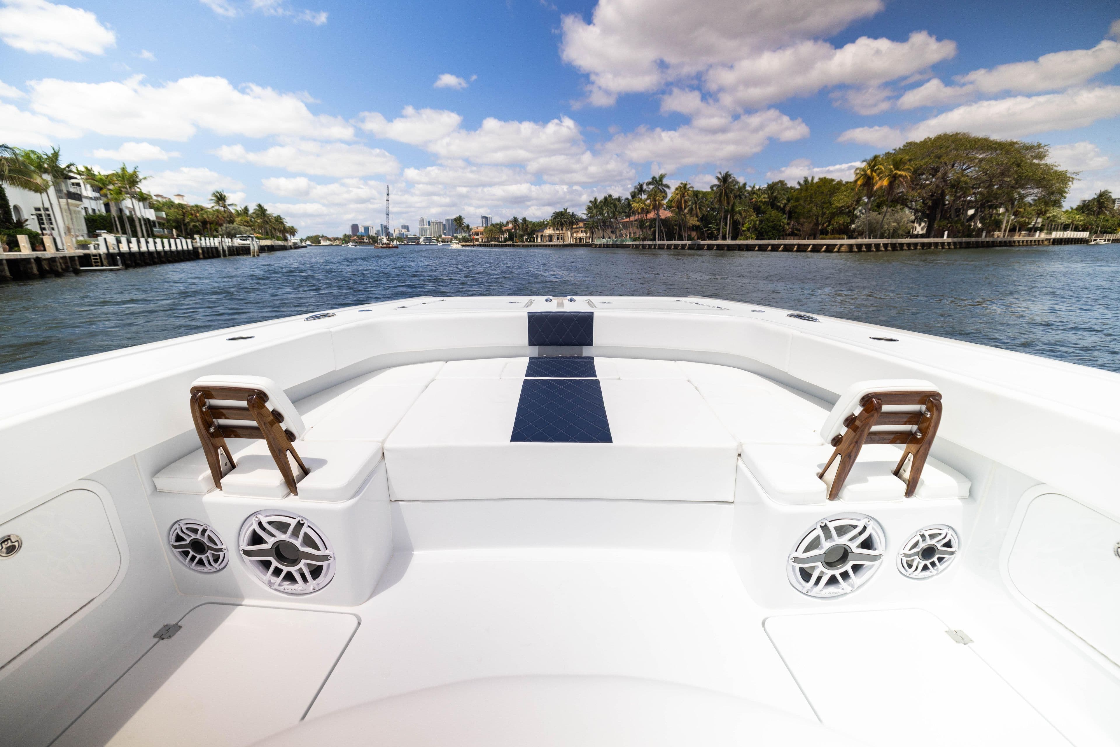 2026 Freeman 47 LX boat interior with waterfront view, clear skies, and luxurious seating.