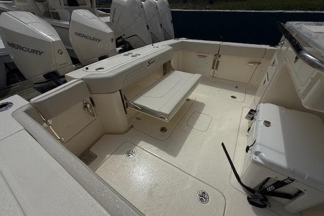 2026 Scout 288 LXF boat deck with seating and Mercury engines.