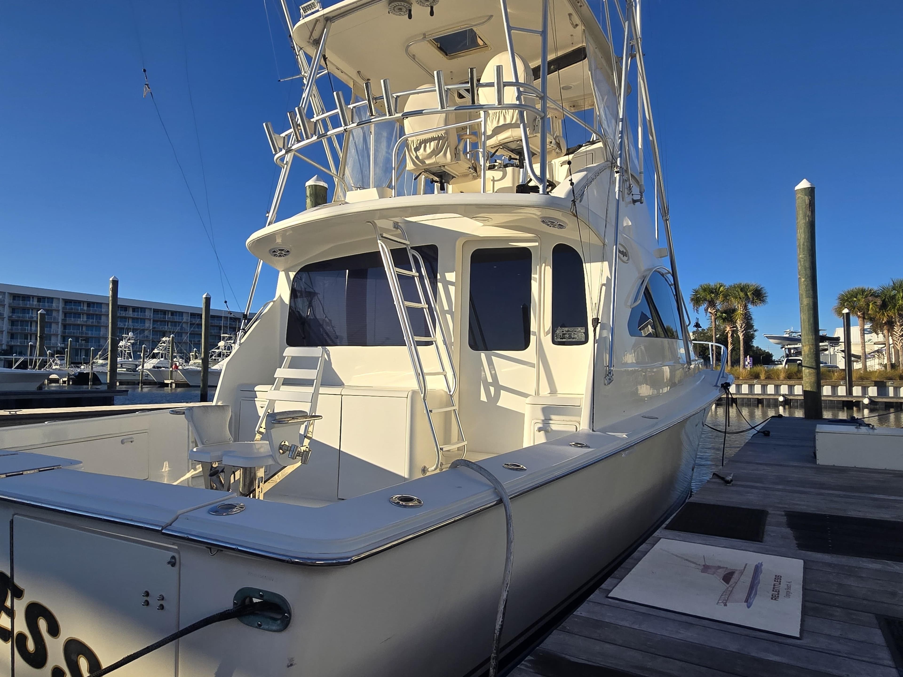 2001 Ocean Yachts 43 Super Sport docked, showcasing sleek design and spacious deck.