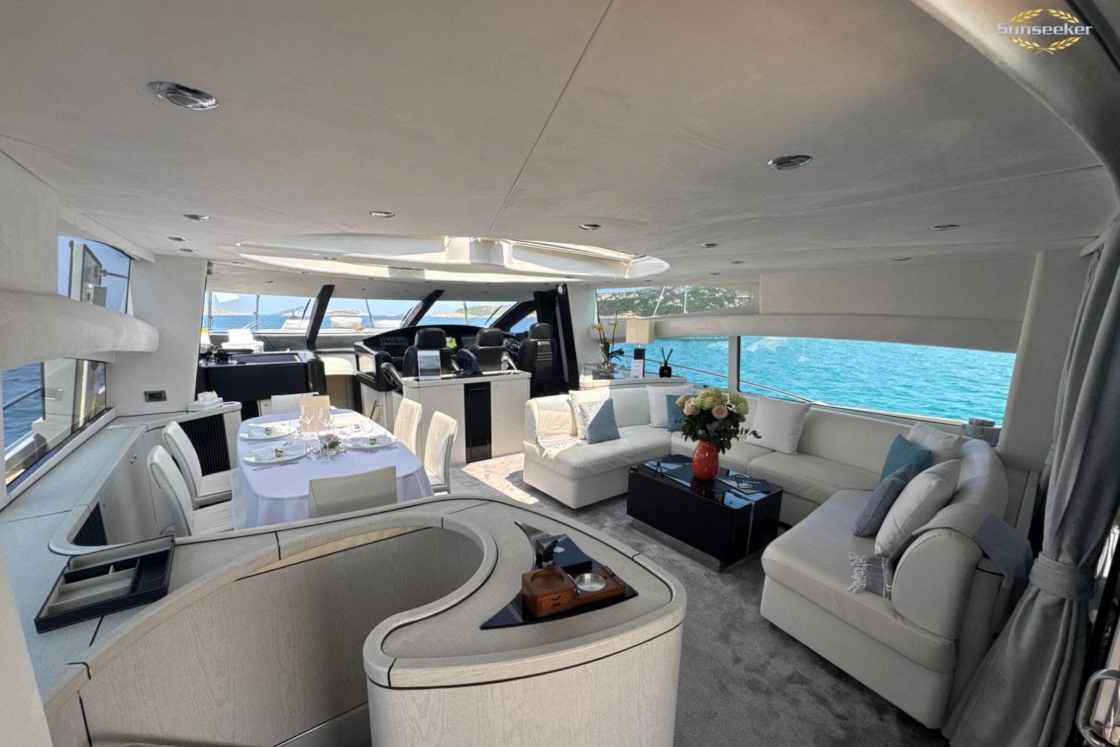 Luxurious interior of 2007 Sunseeker Predator 82 yacht with elegant seating and dining area.