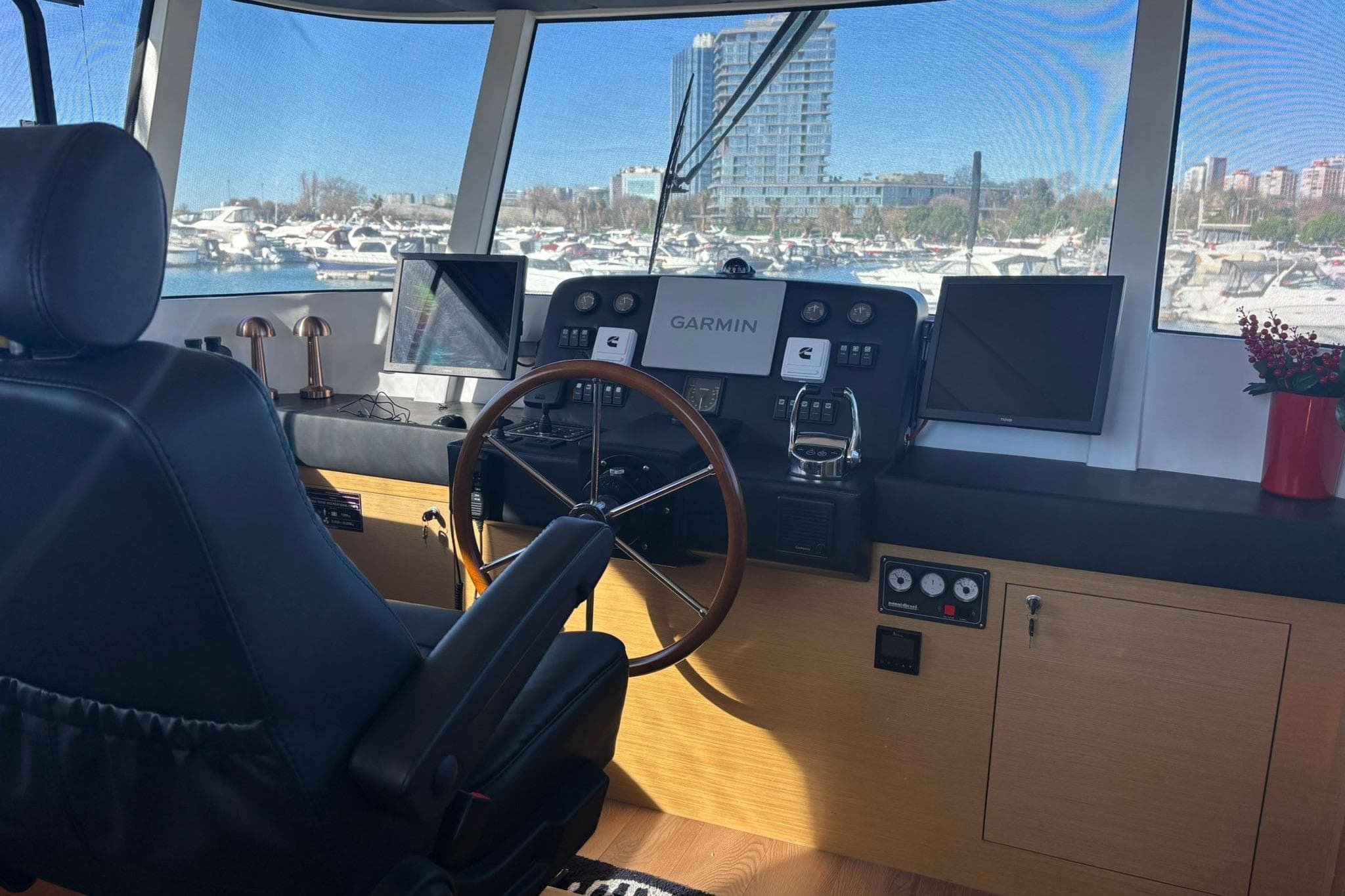 Pilot cabin of 2025 KRC Yachting KRC57 with navigation equipment and marina view.