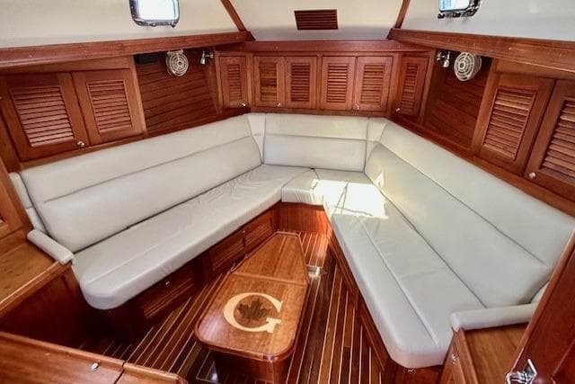 Luxurious interior of 2016 Gozzard 41 RC yacht with elegant wood finish and plush seating.