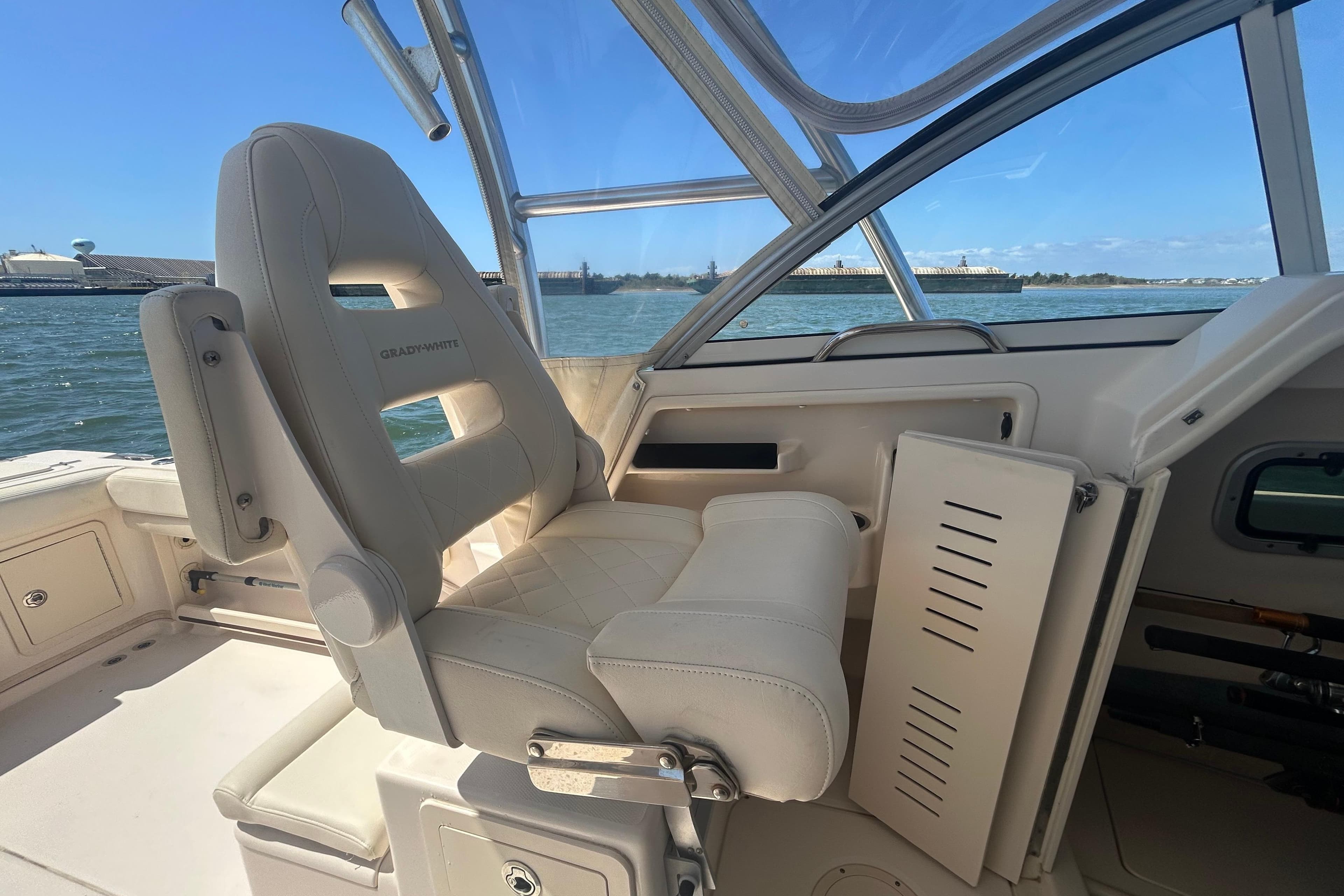 2021 Grady-White Gulfstream 232 boat interior with comfortable seating and ocean view.