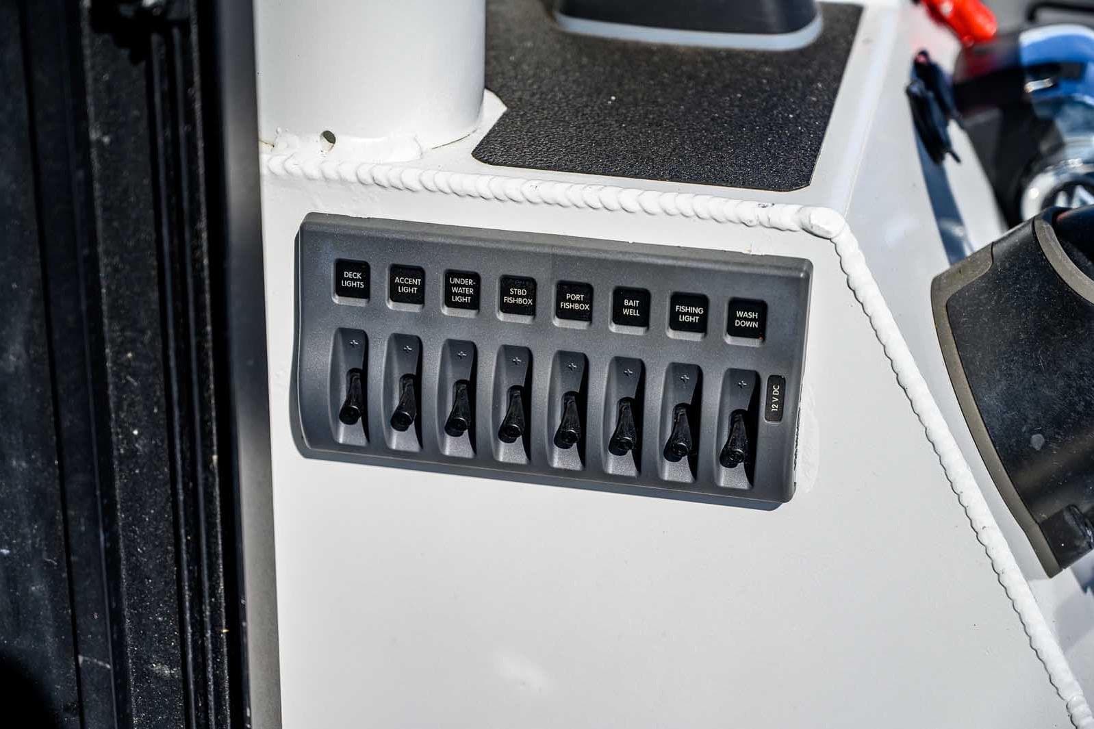 Control panel of 2021 Wooldridge 33 Deep Water Explorer boat with labeled switches.