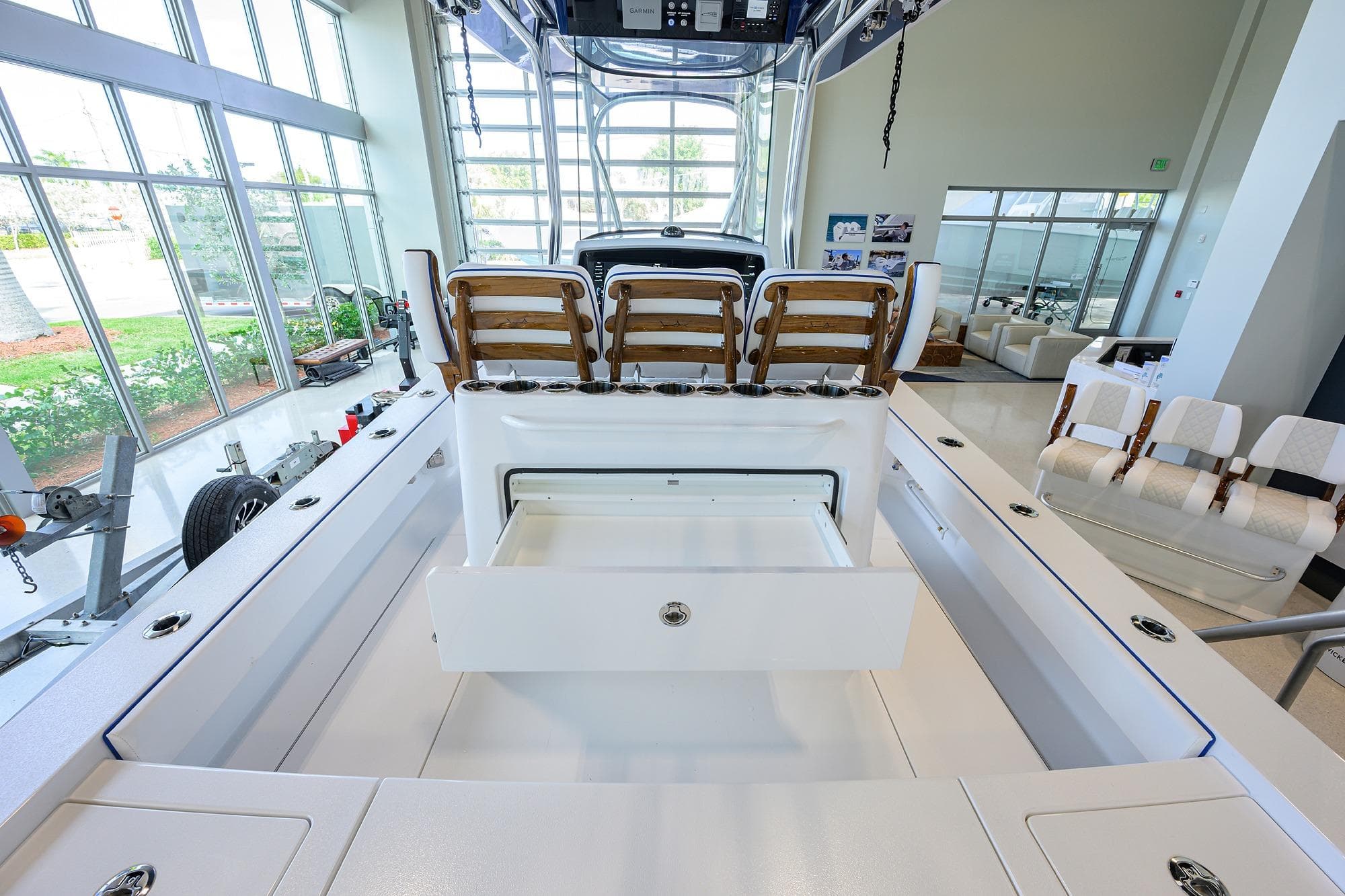 2026 Valhalla Boatworks V-28 Bay interior with seating and storage in showroom.