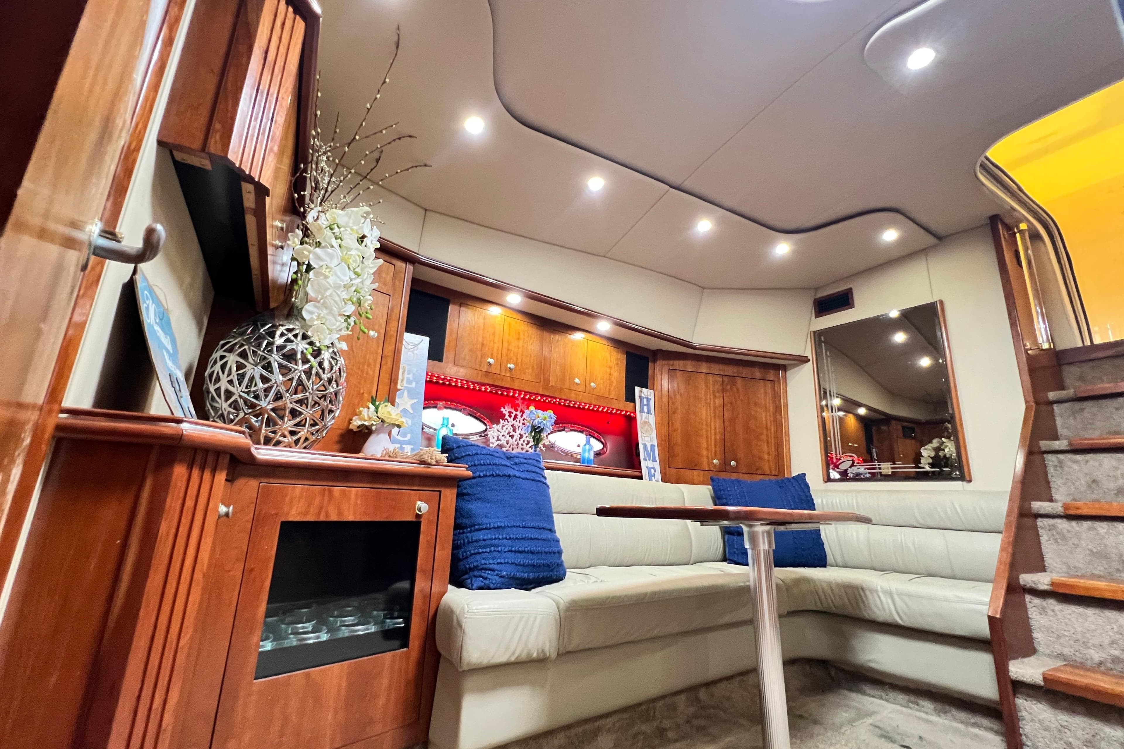 Luxurious interior of 2005 Cruisers Yachts 440 Express with elegant seating and decor.