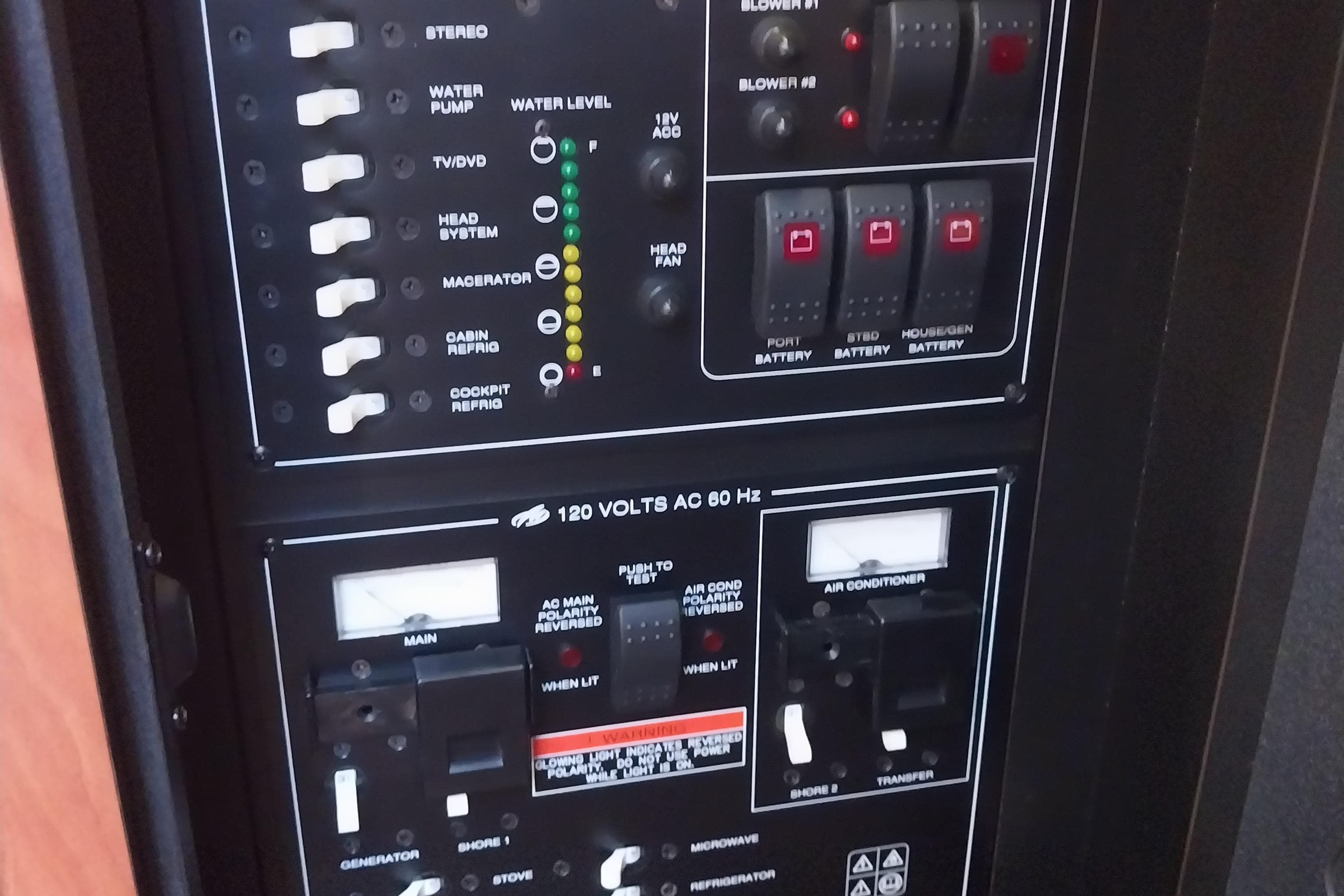 Control panel of a 2011 Monterey 340 Sport Yacht, featuring switches and indicators.