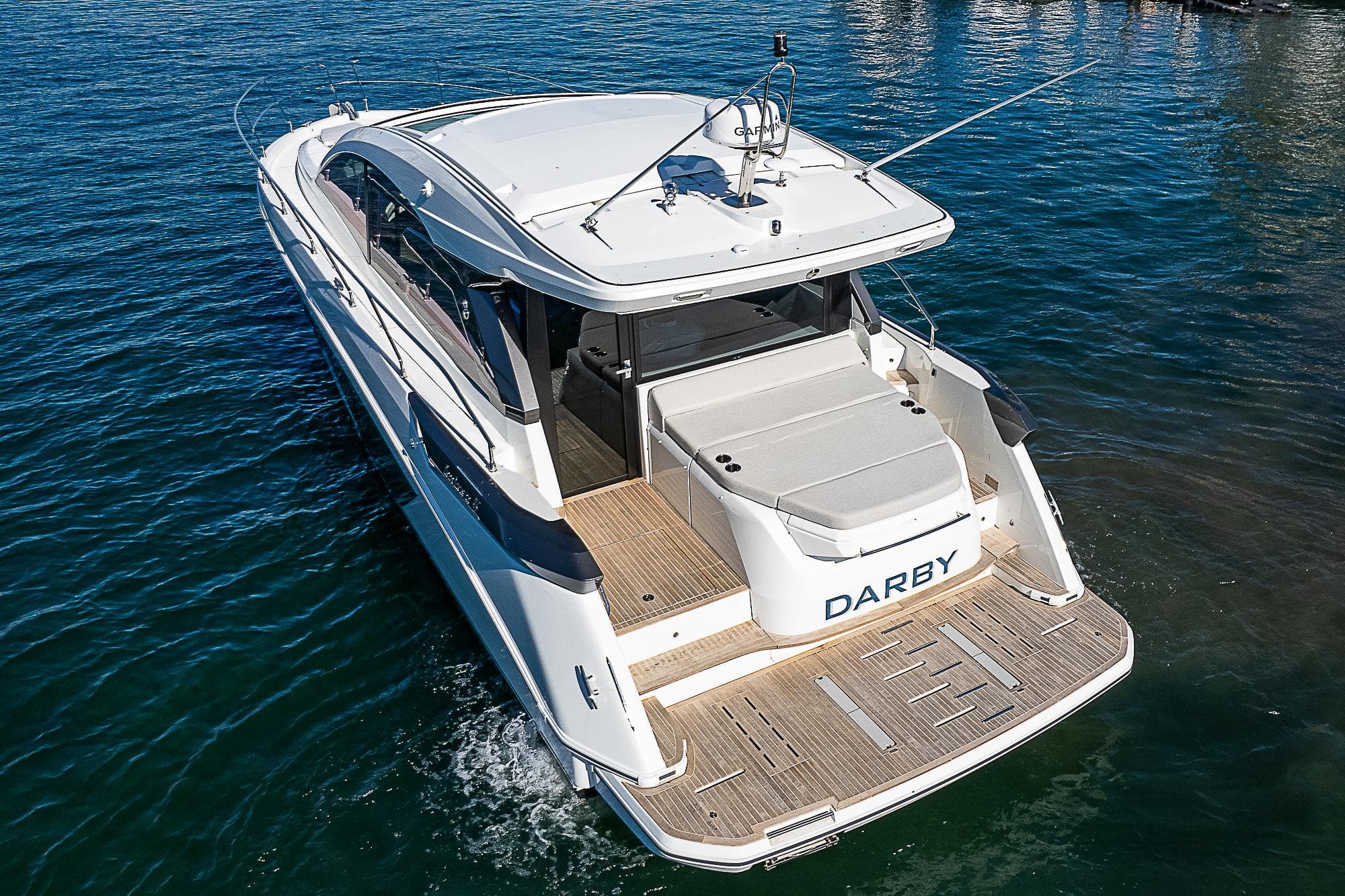 2022 Beneteau Gran Turismo 45 yacht on water, rear view.