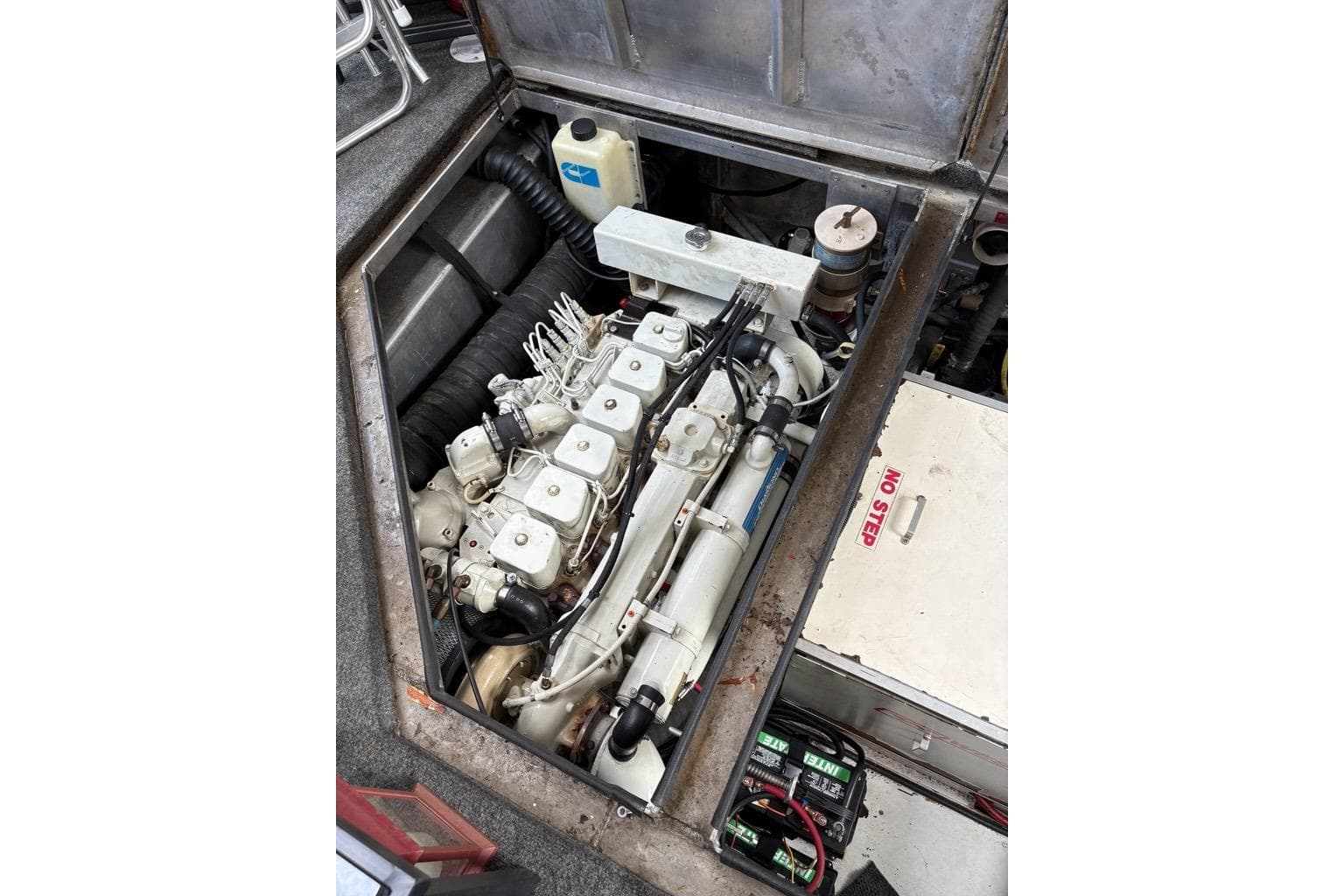 Engine compartment of a 2000 Monticello River Yacht, showcasing detailed mechanical components.