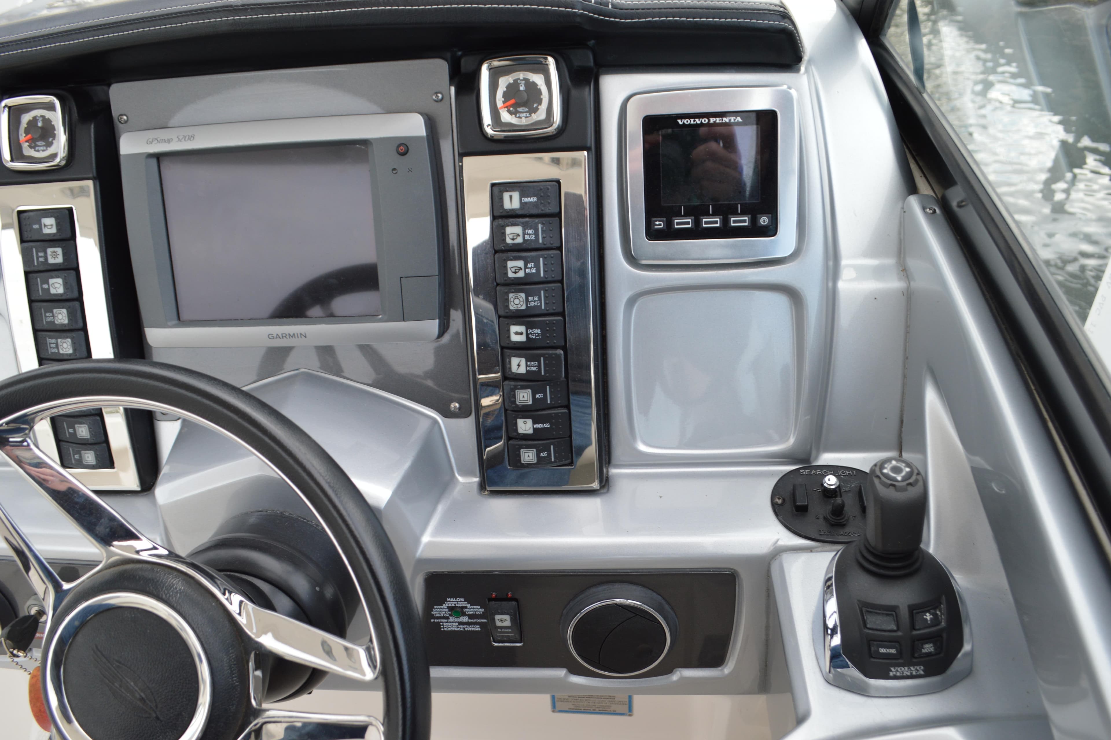 Control panel of 2013 Chaparral 327 SSX boat with Garmin and Volvo Penta displays.