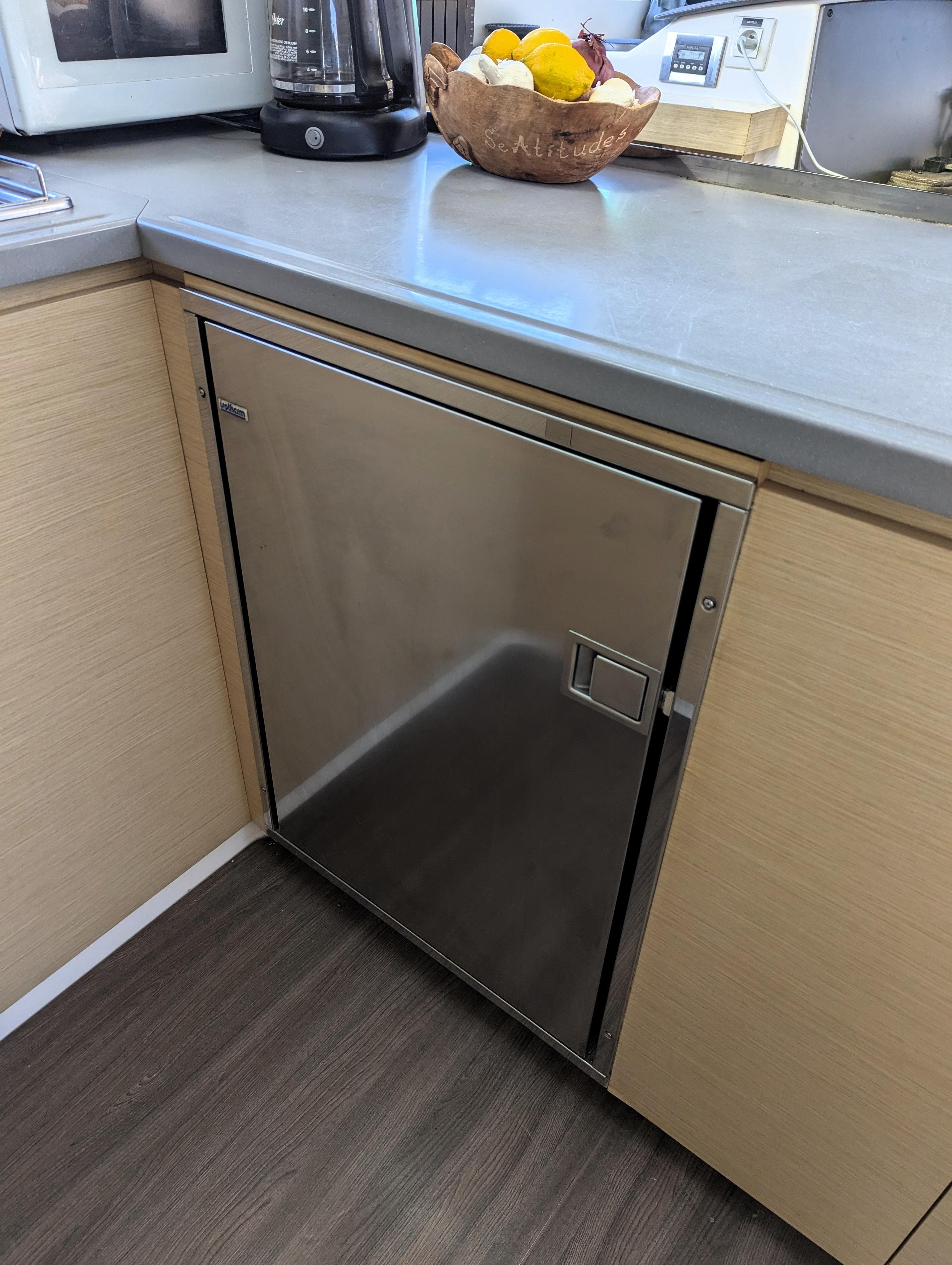 Stainless steel fridge in 2017 Fountaine Pajot Helia 44 Evolution yacht kitchen.