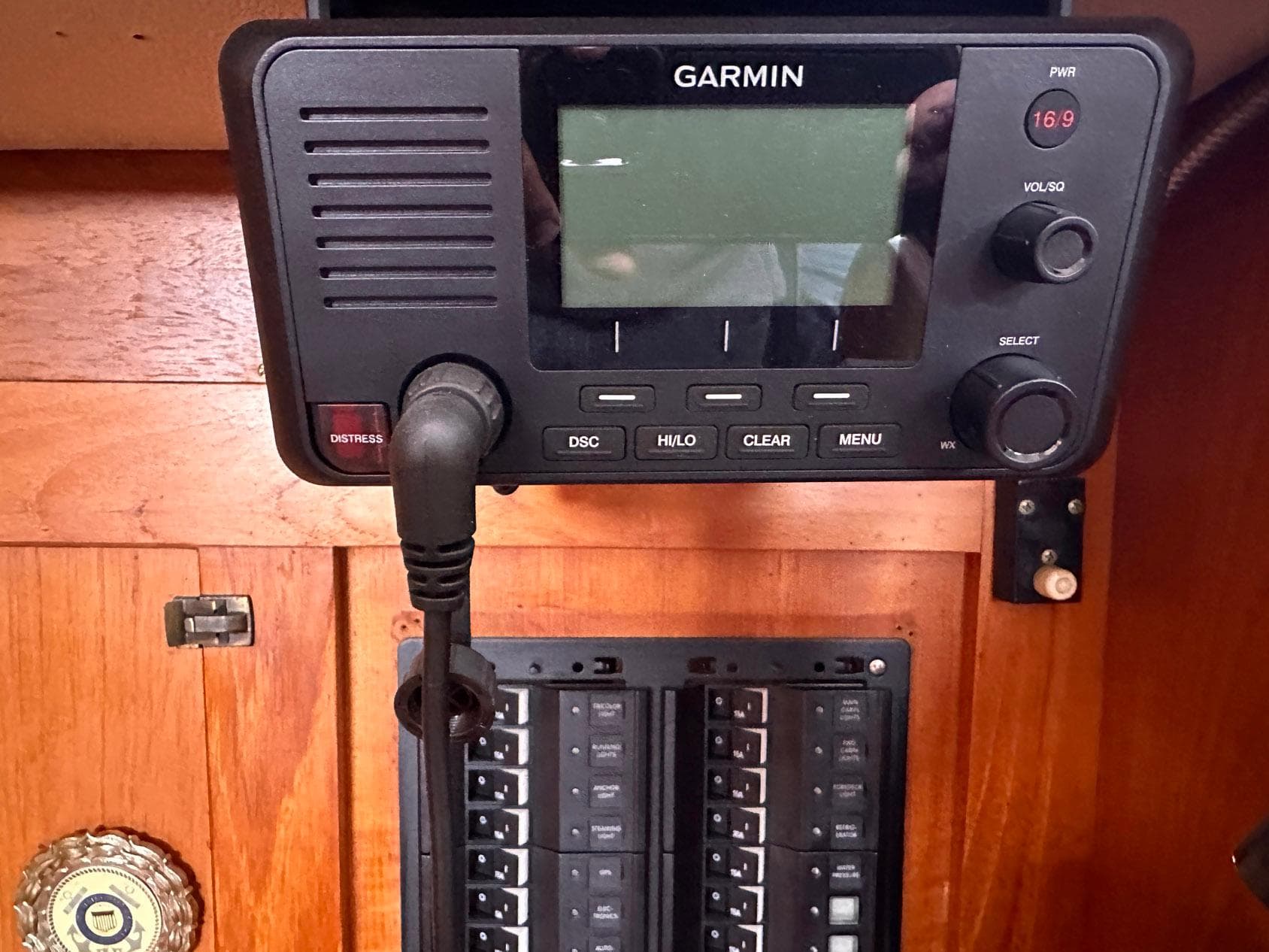 Garmin marine radio and control panel on a 1985 Whiting 40 sailboat.