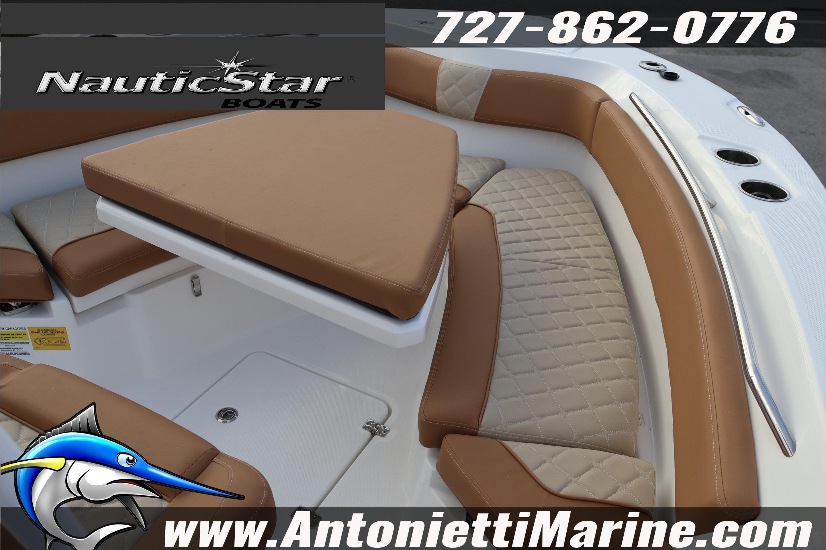 2026 NauticStar 222 Offshore boat interior with tan seating, contact info, and logo.