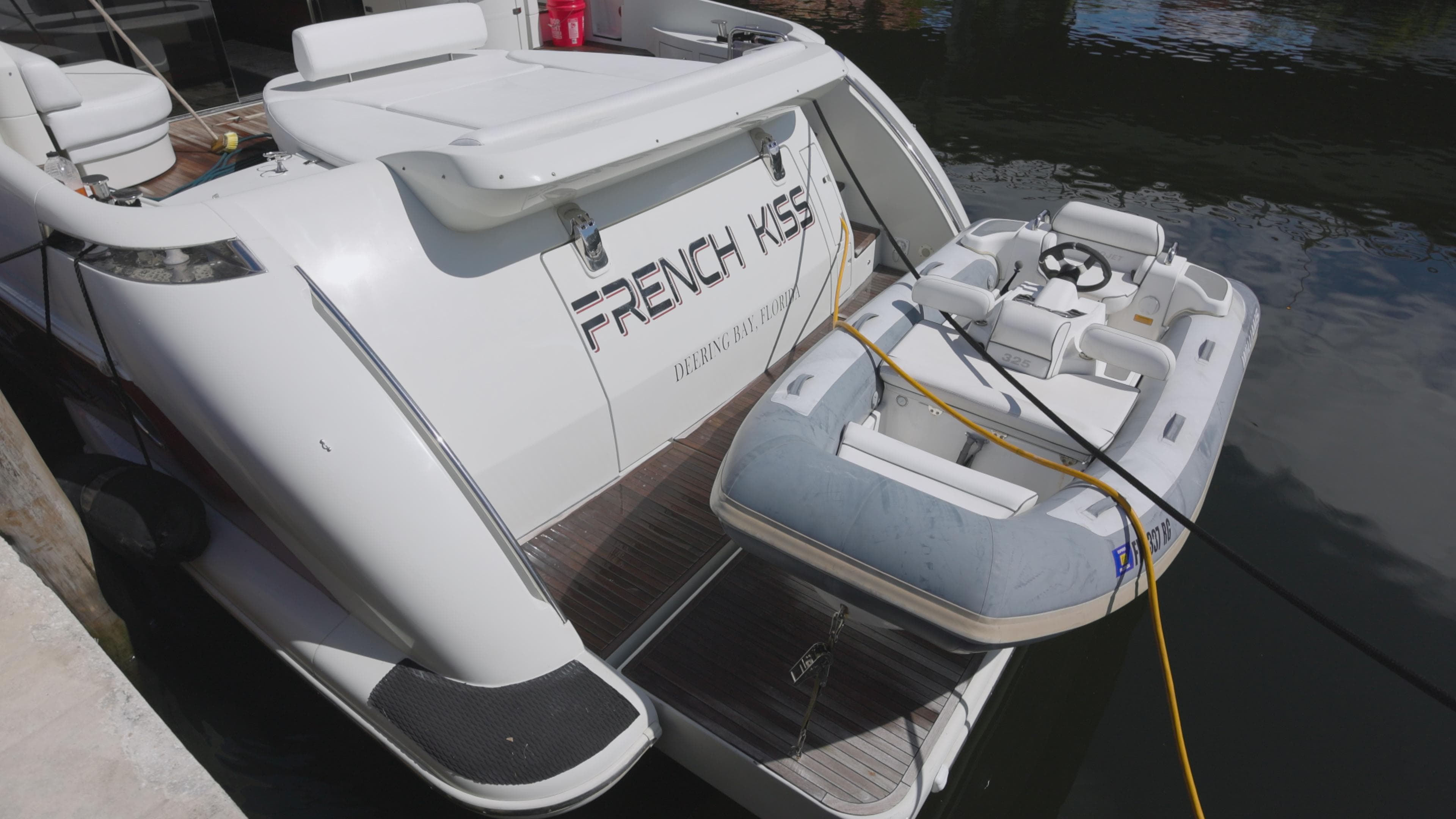 2008 Azimut 62S yacht with a small inflatable boat docked.