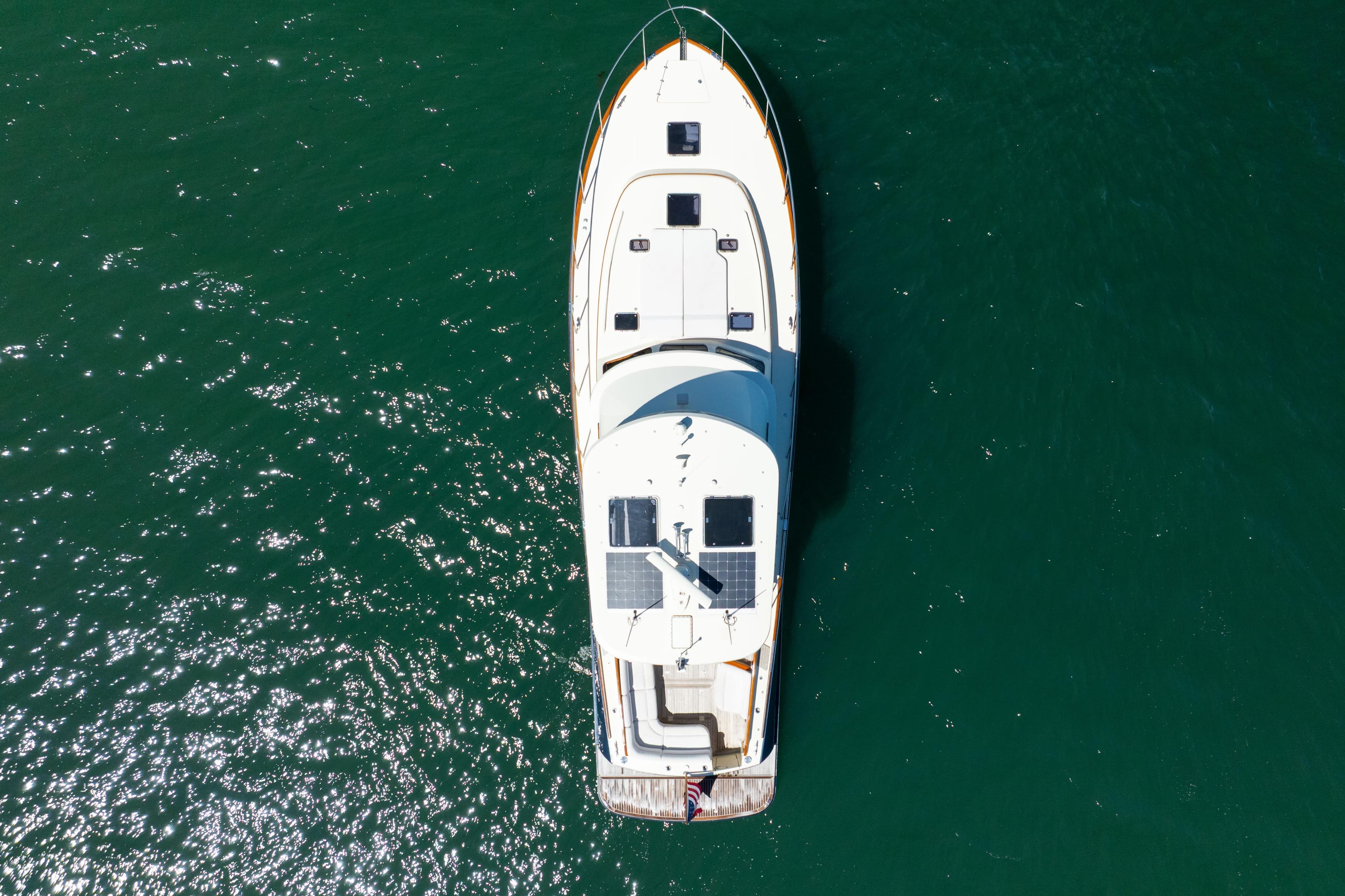 Overhead view of 2014 Hinckley Talaria 48 Flybridge yacht on open water.
