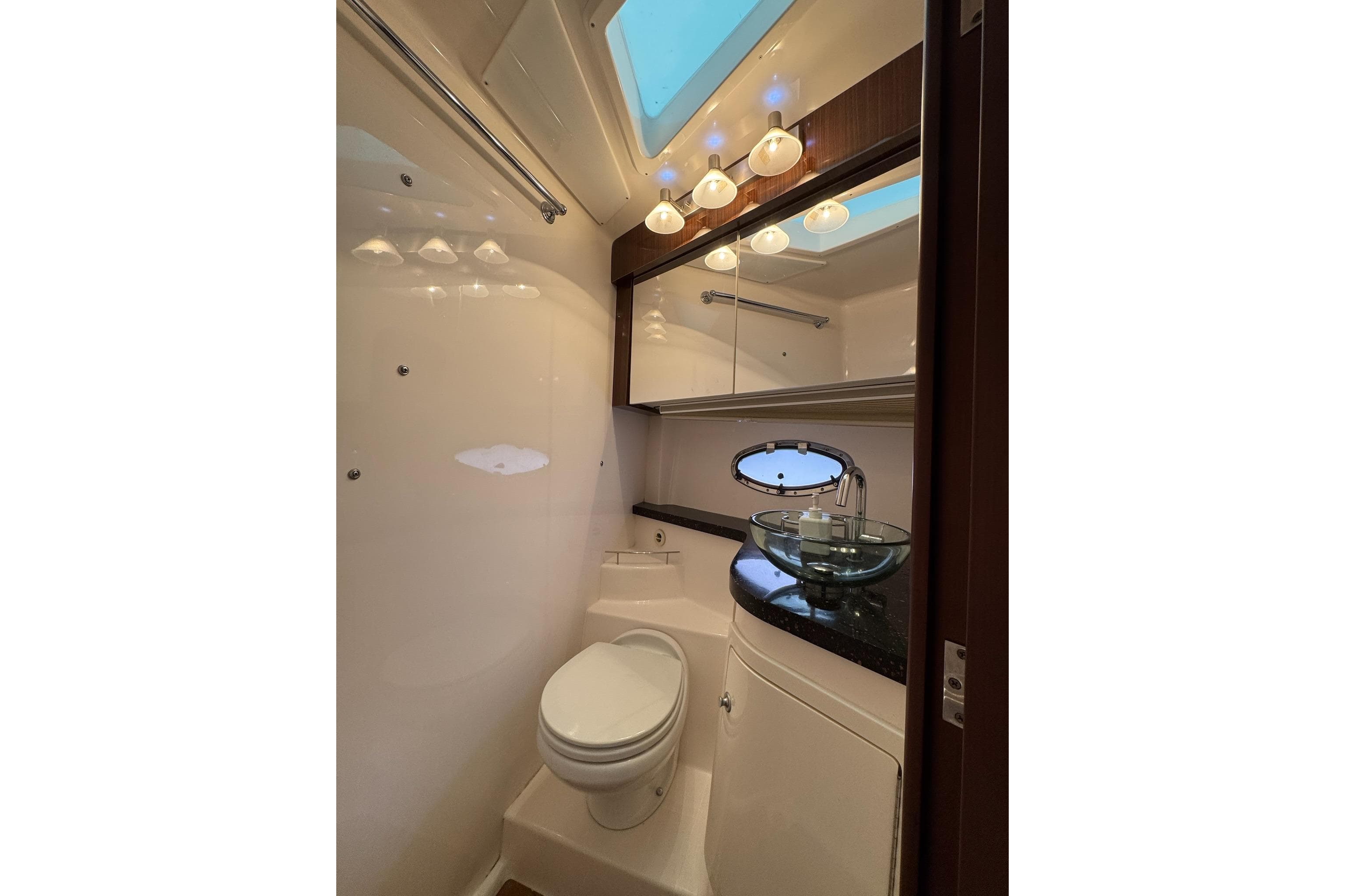 Luxurious bathroom in 2015 Regal 42 Sport Coupe yacht with modern fixtures.