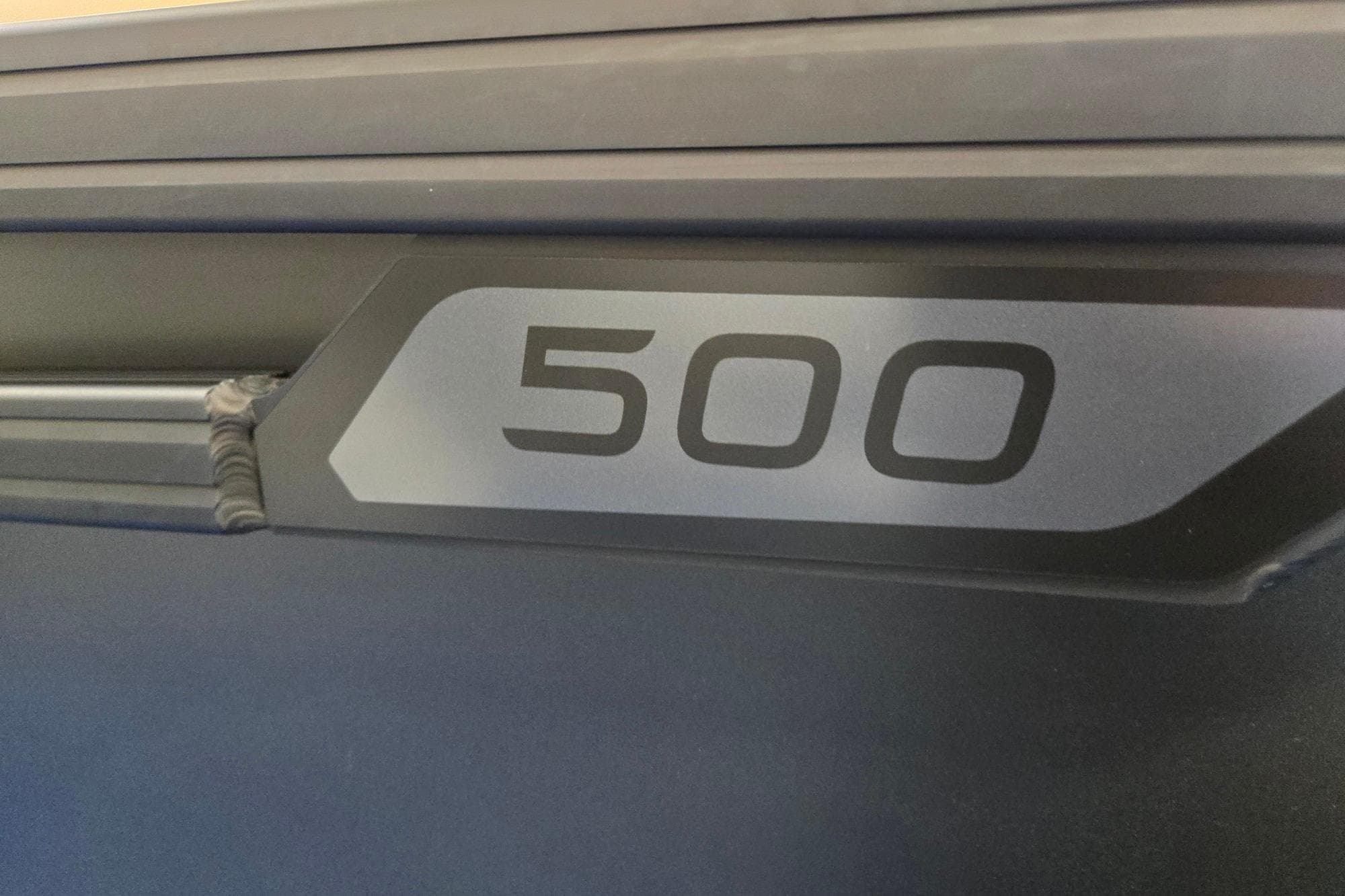 Close-up of Evotti 521QL 2026 model with "500" label on dark surface.