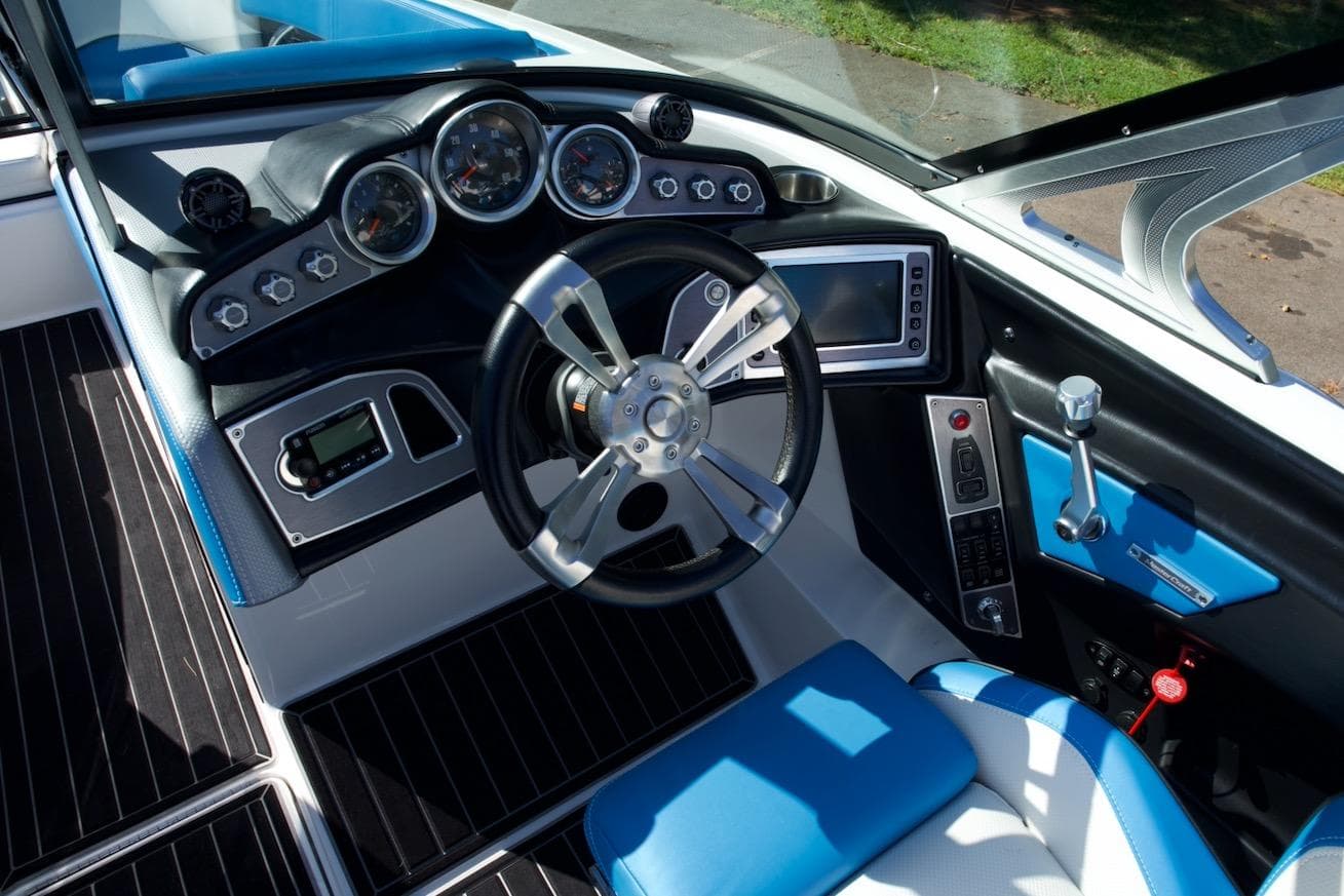 2017 MasterCraft X26 boat cockpit with modern steering wheel and dashboard controls.