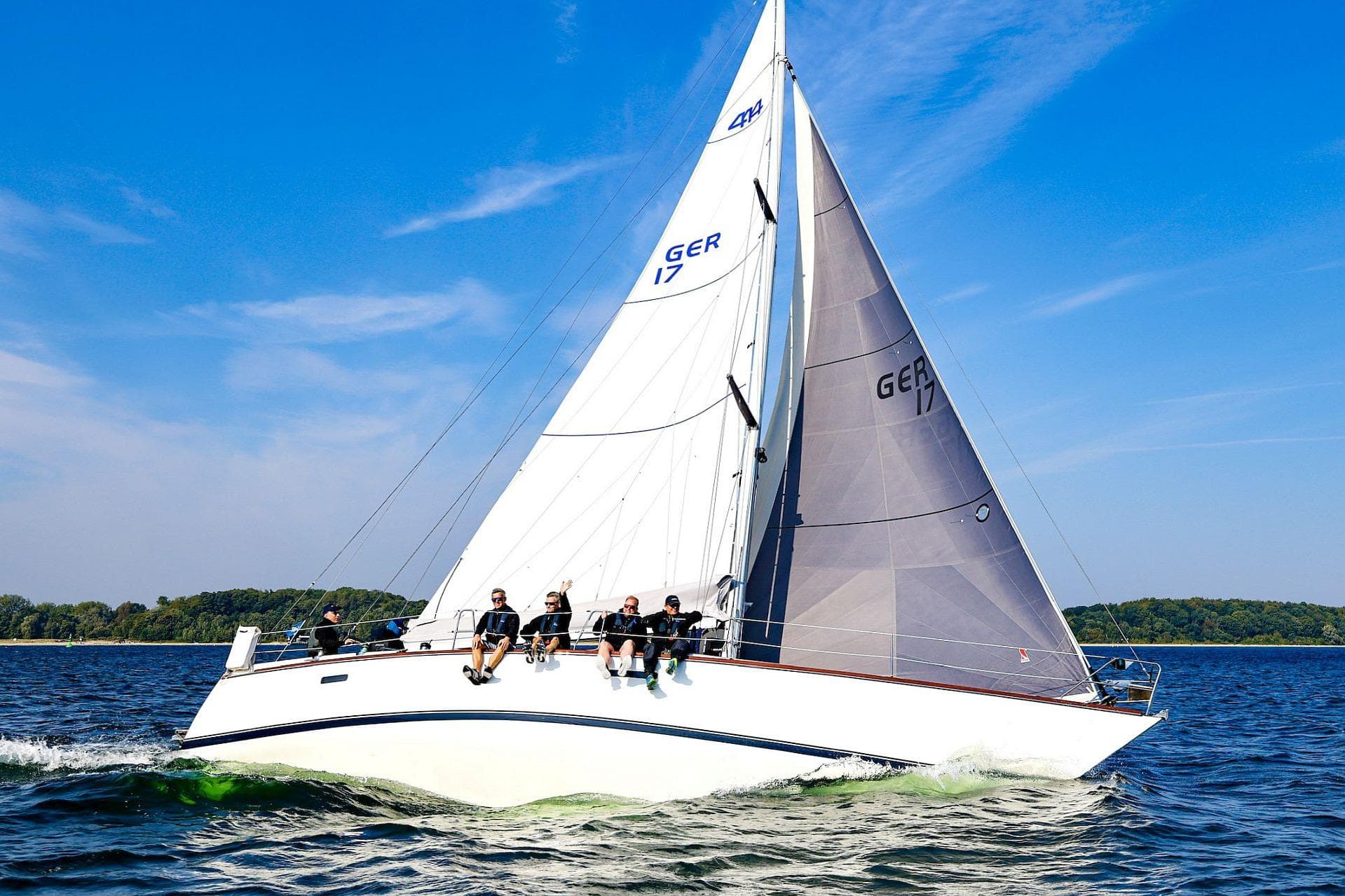 Sailing yacht Bianca 414 from 1981 on open water under clear blue skies.