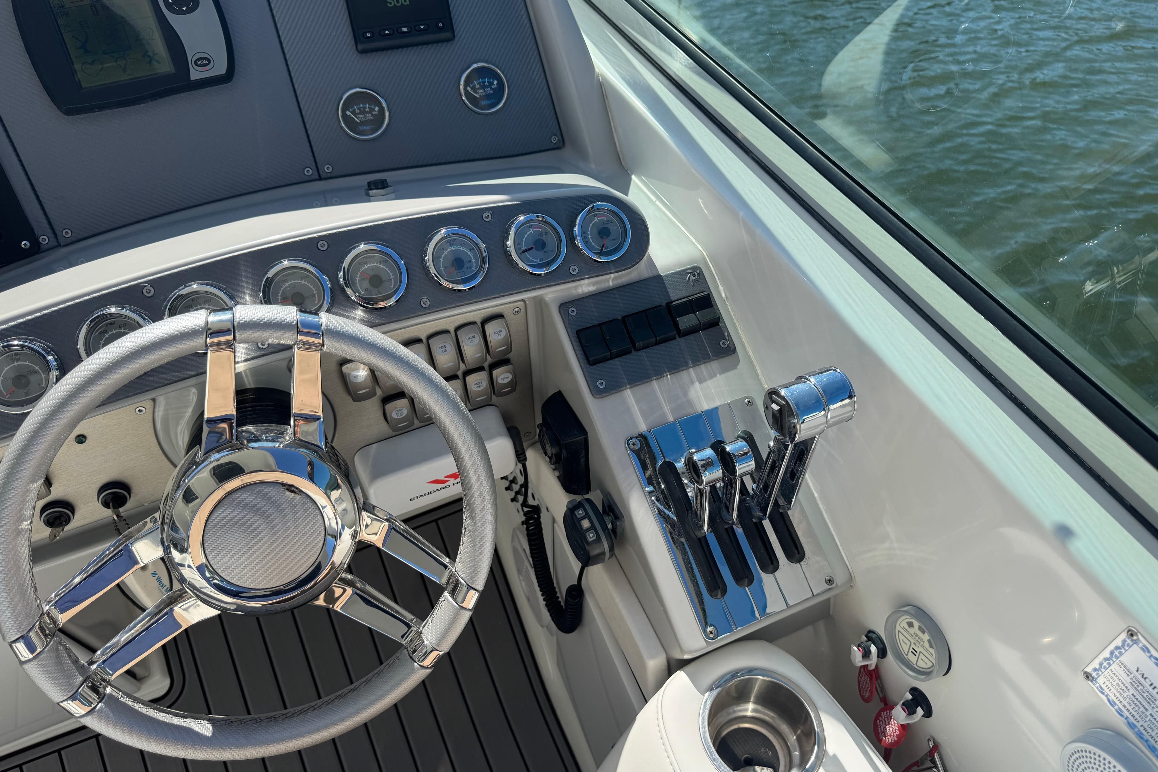 2006 Formula 400 Super Sport boat dashboard with steering wheel and controls.