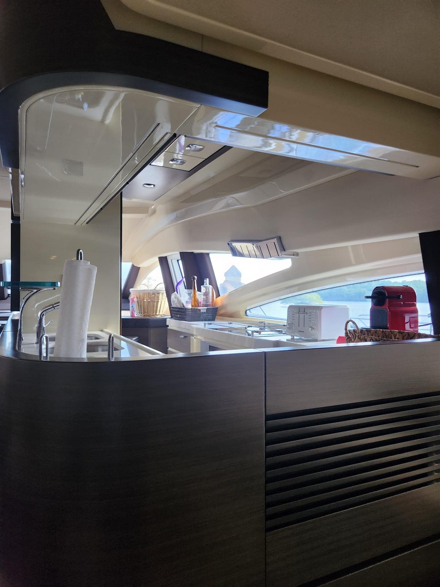 Interior of a 2014 Azimut Flybridge yacht, featuring a modern kitchen area.