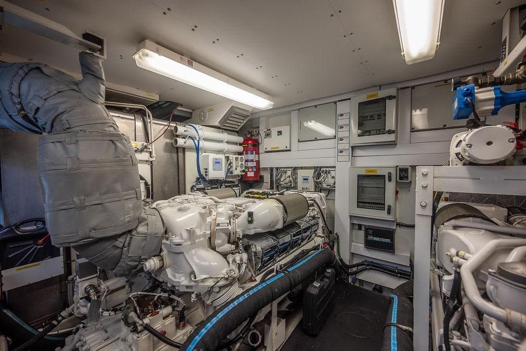 Engine room of a 2012 Sunseeker Manhattan 73 yacht, showcasing machinery and control panels.