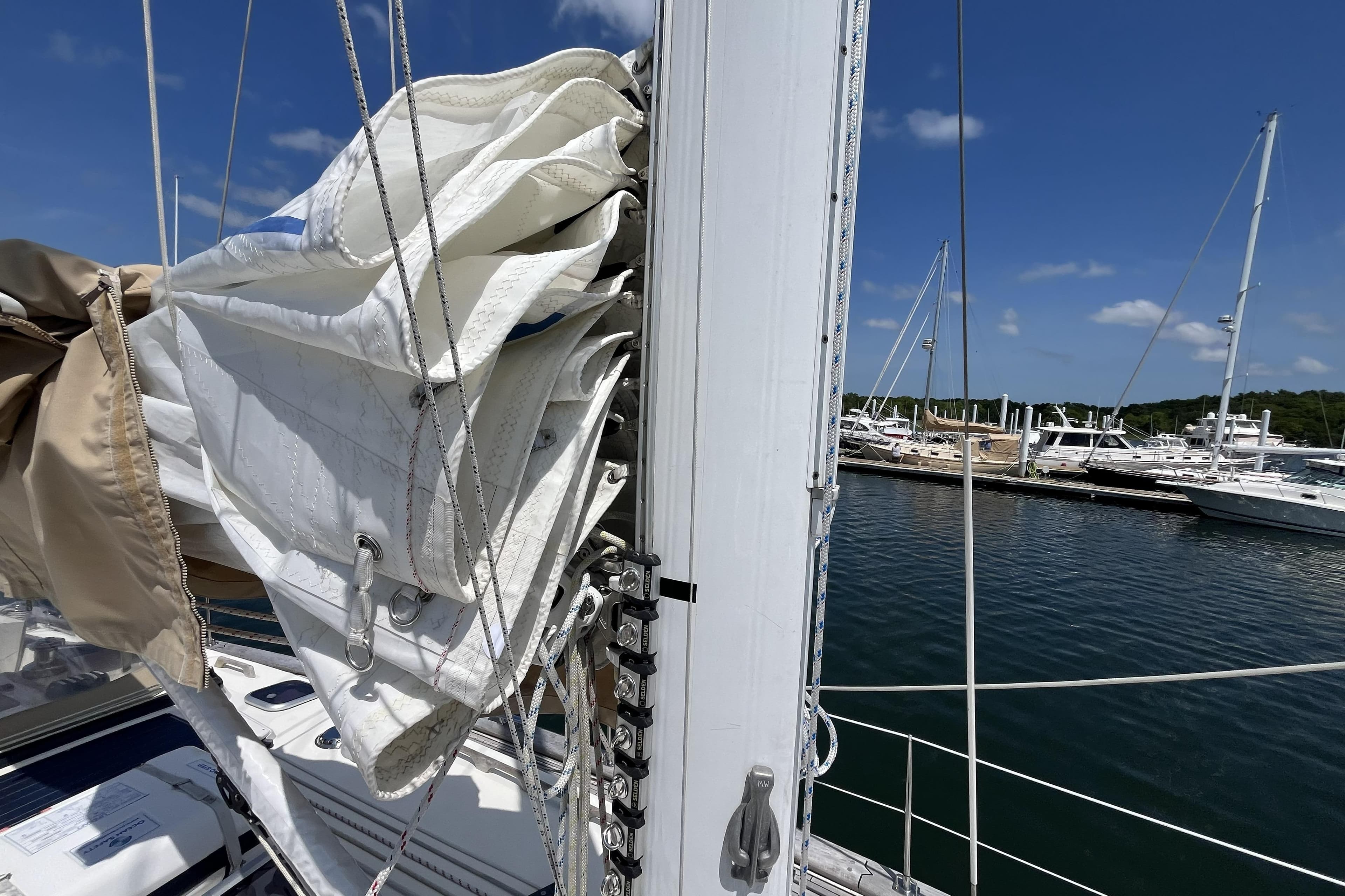 Sailboat mast and rigging on a 2017 Rustler 37 at a marina.