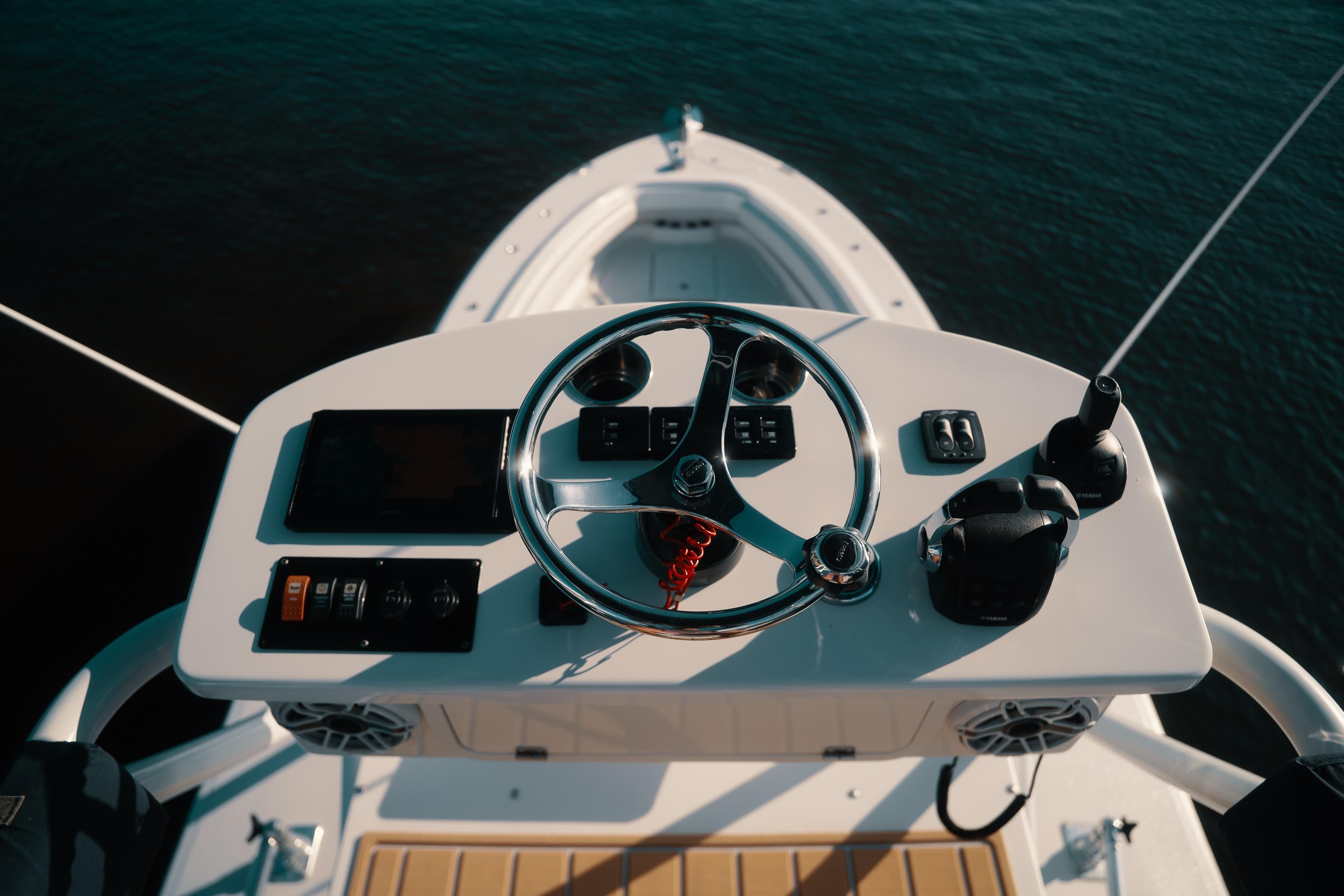Helm of 2019 HCB 42 Siesta boat with steering wheel and controls.