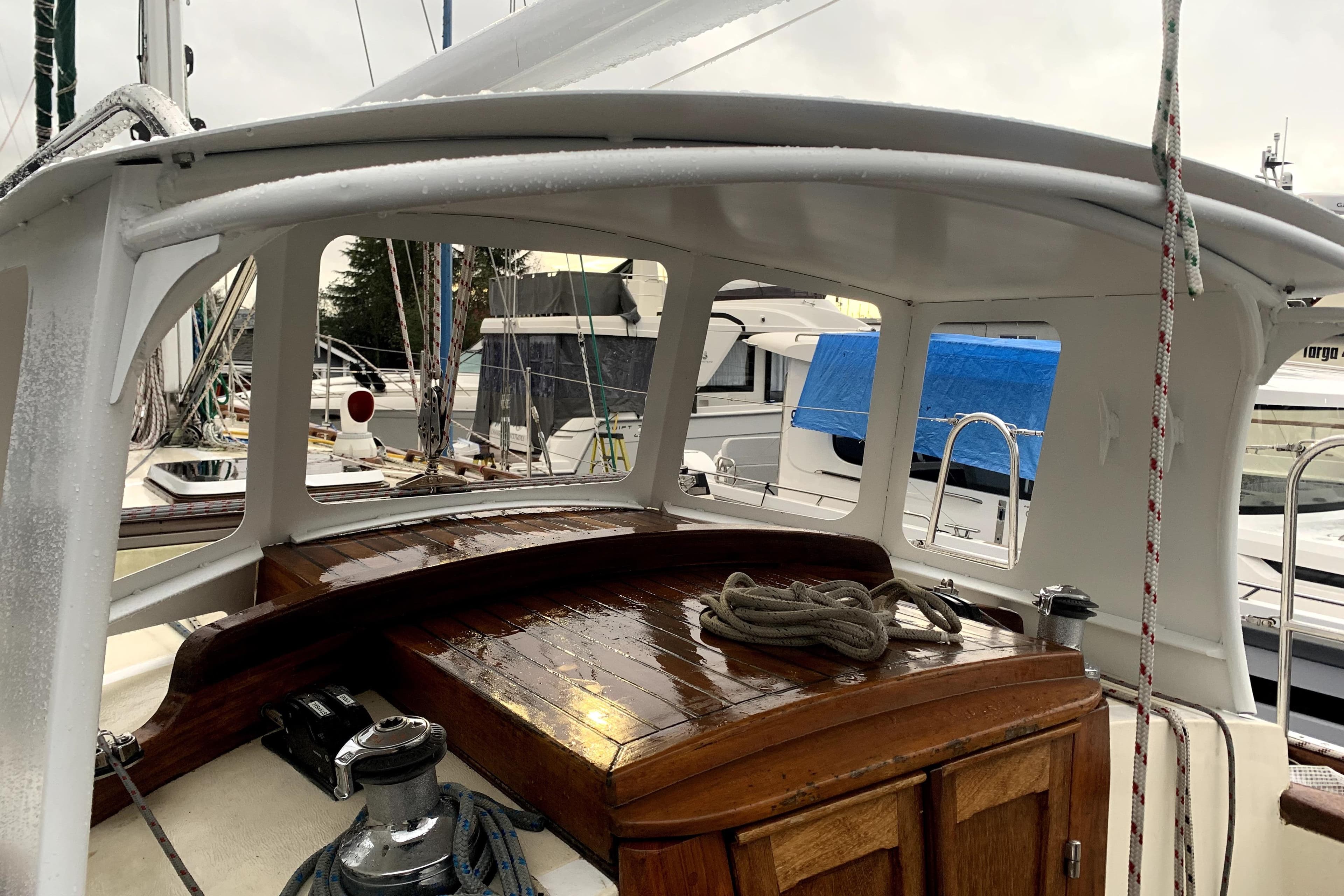 Sailboat cockpit with wooden deck, ropes, and winch, Seawing-Atkins Custom 2003 model.