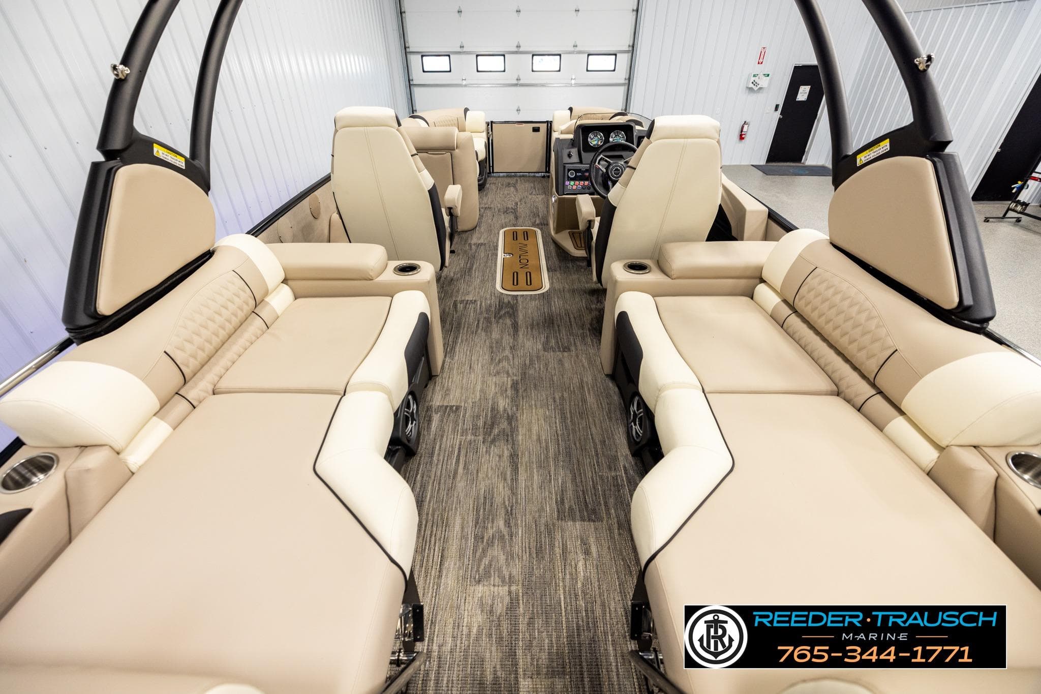 Luxurious interior of 2026 Avalon CAT QLS pontoon boat with beige seating.