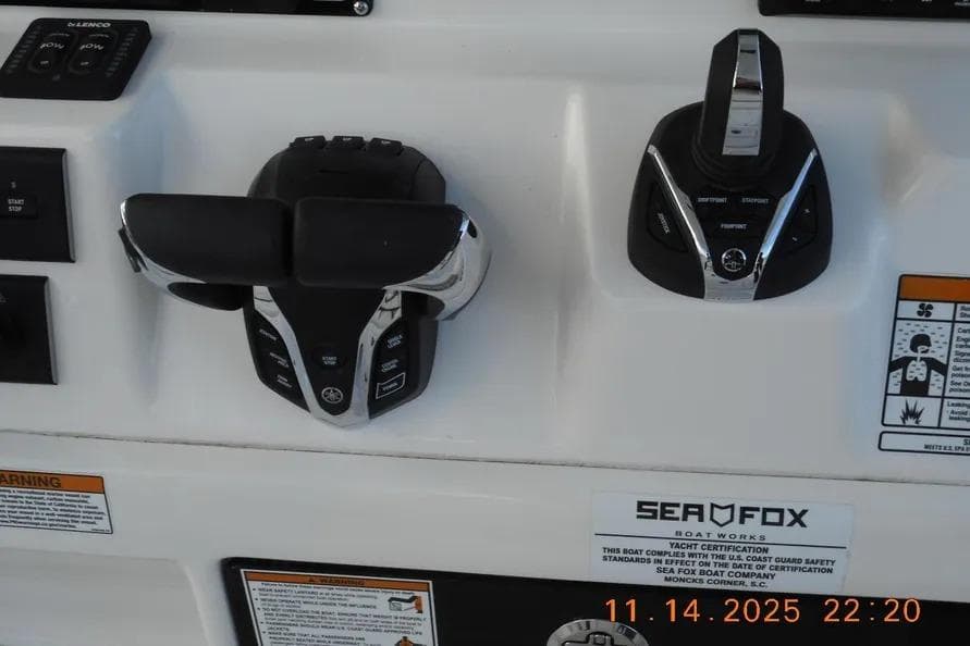Control panel of a 2026 Sea Fox 288 Commander boat with throttle and joystick.