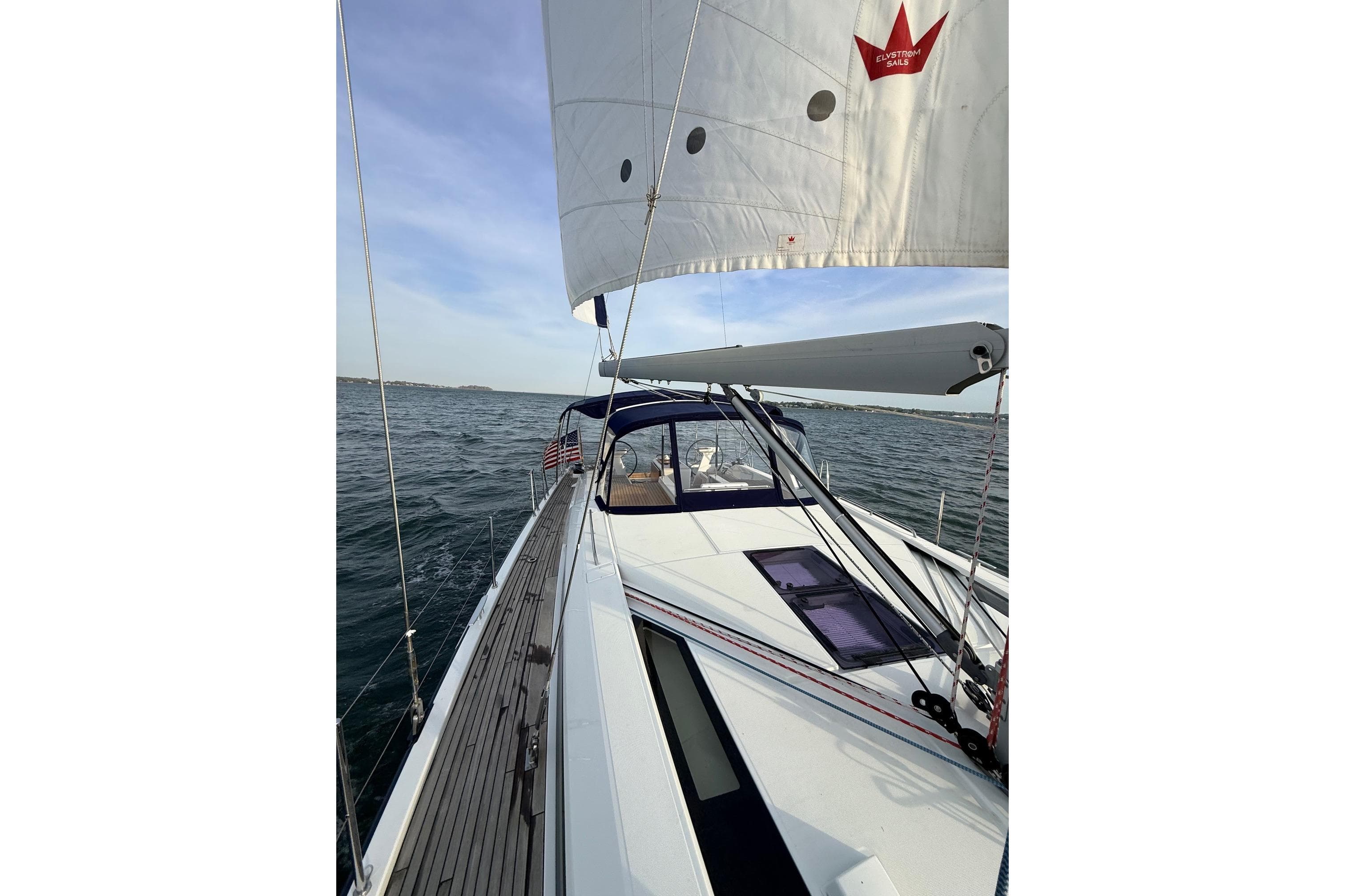 2019 Beneteau Oceanis 51.1 sailing on open water, showcasing sleek design and sails.