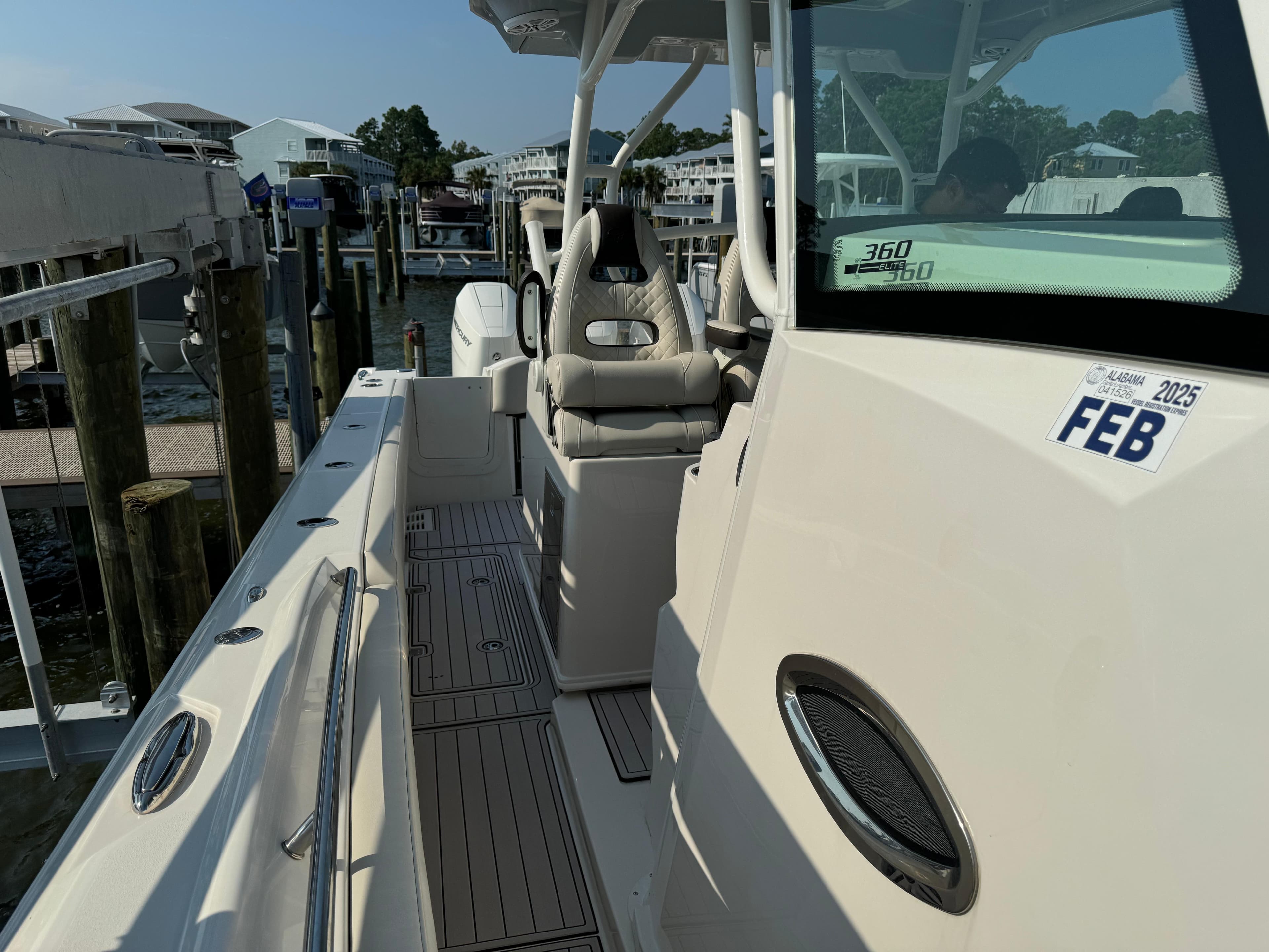 2024 Sailfish 360 CC boat docked, featuring sleek design and comfortable seating.