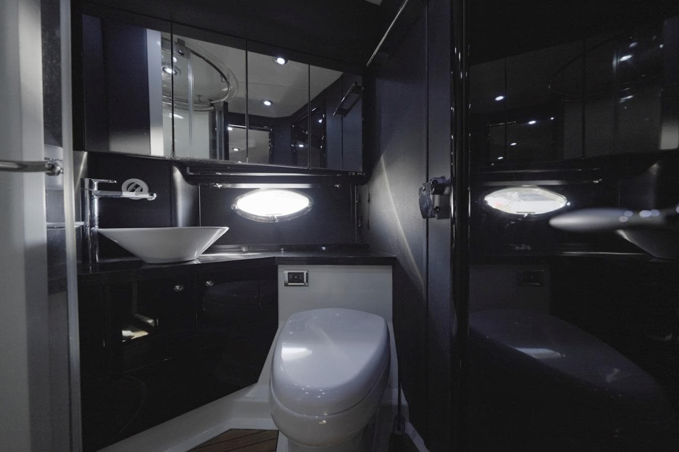 Luxurious bathroom interior of 2007 Sunseeker Predator 62 yacht, featuring modern fixtures and sleek design.